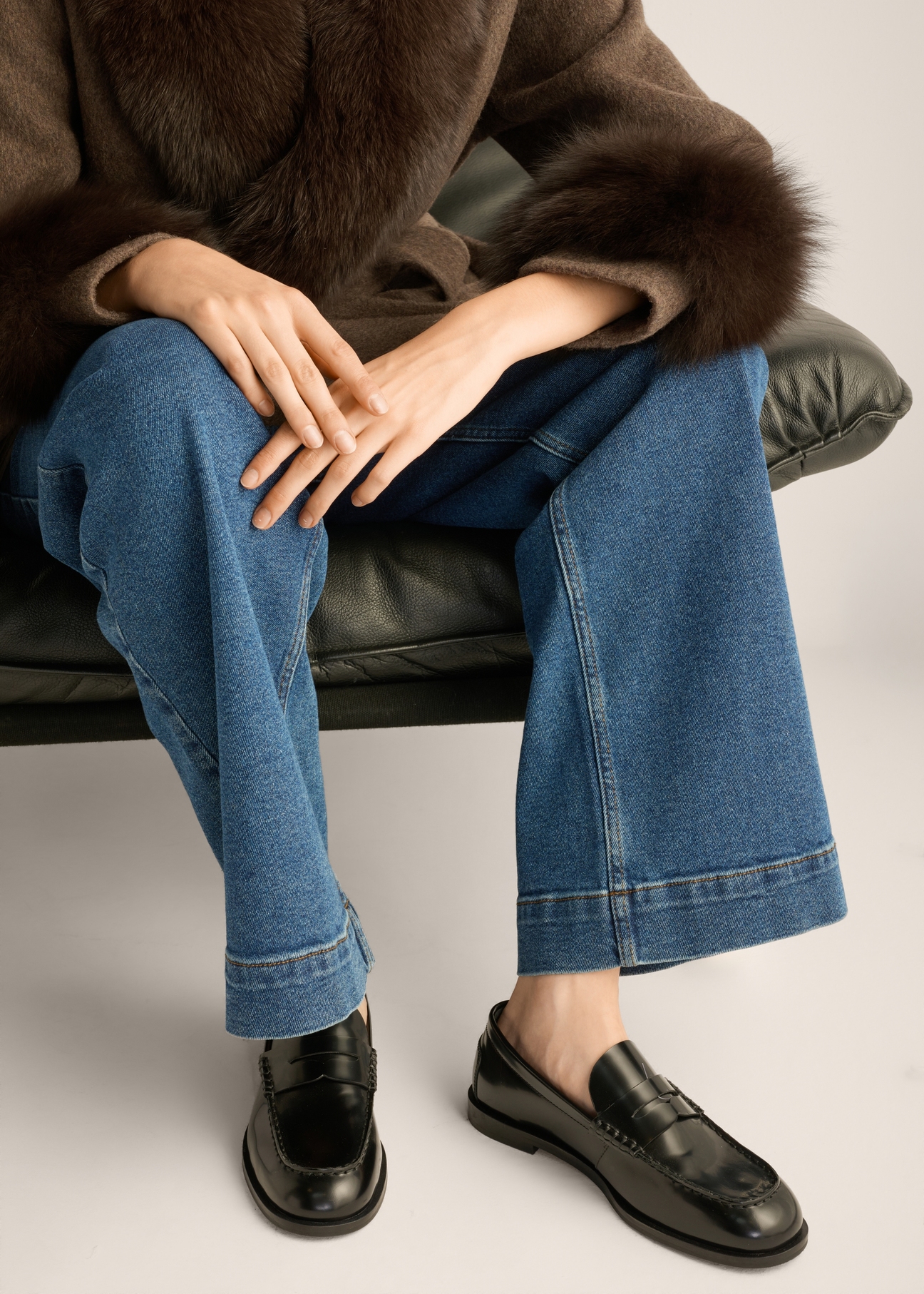 Women's black leather moccasins BUTYD-1355-9F(Z26), front view of the product on the model's feet, on a light background.
