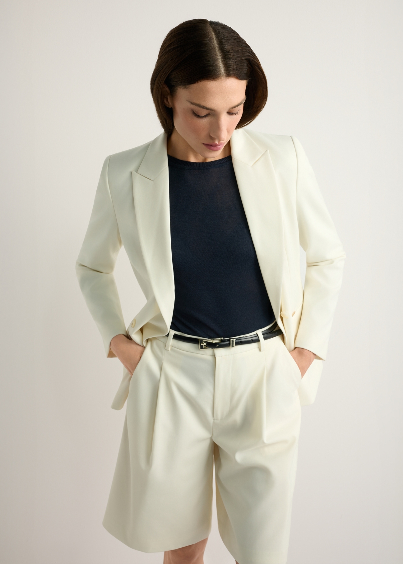 Women's white wool-blend jacket ZAKDT-0045-0B(W26), front view of the product on the model. Half of the silhouette visible.