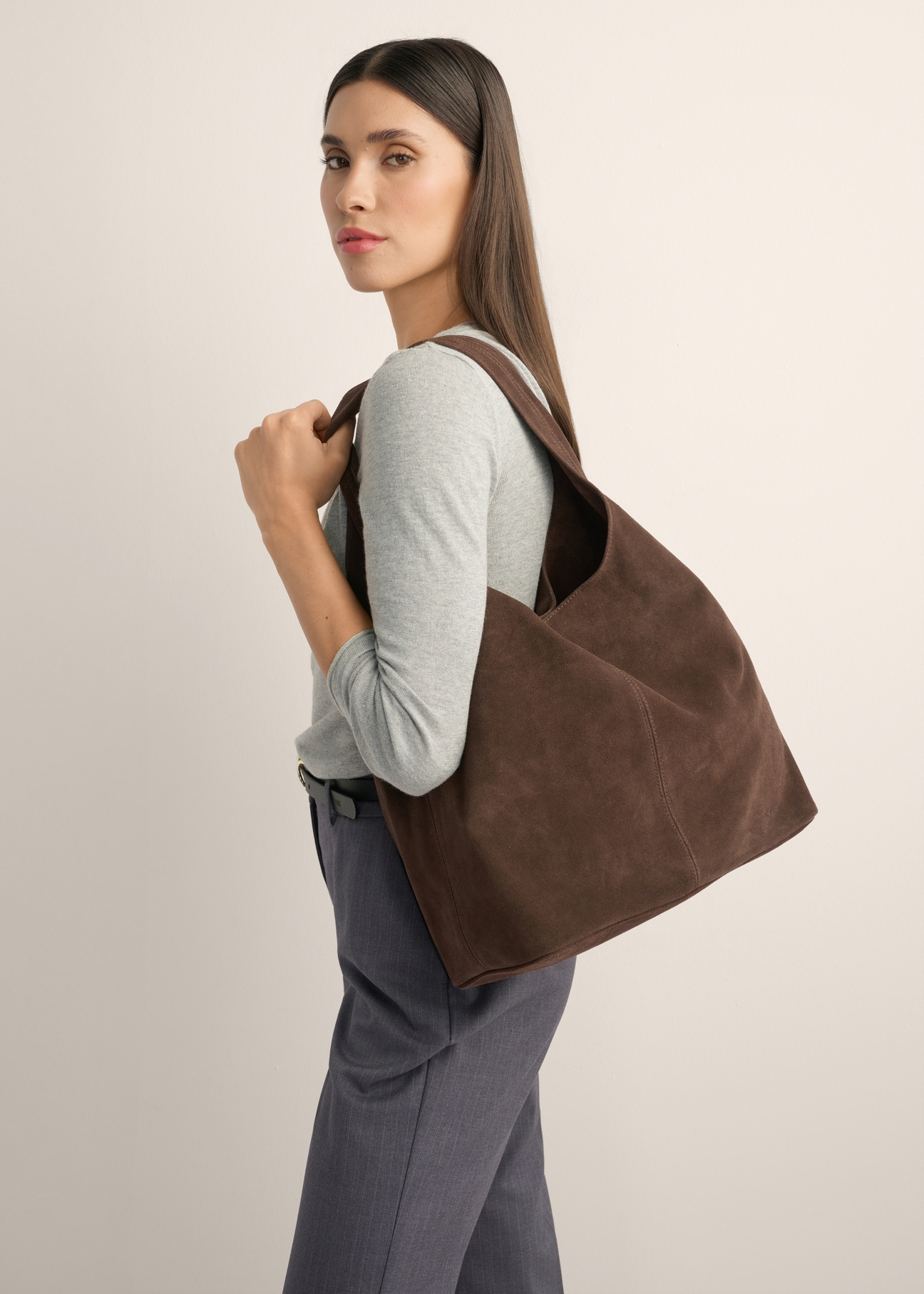 Brown suede shopper bag TORES-1403-1H(Z26), front view of the product on a model, half of the silhouette visible.