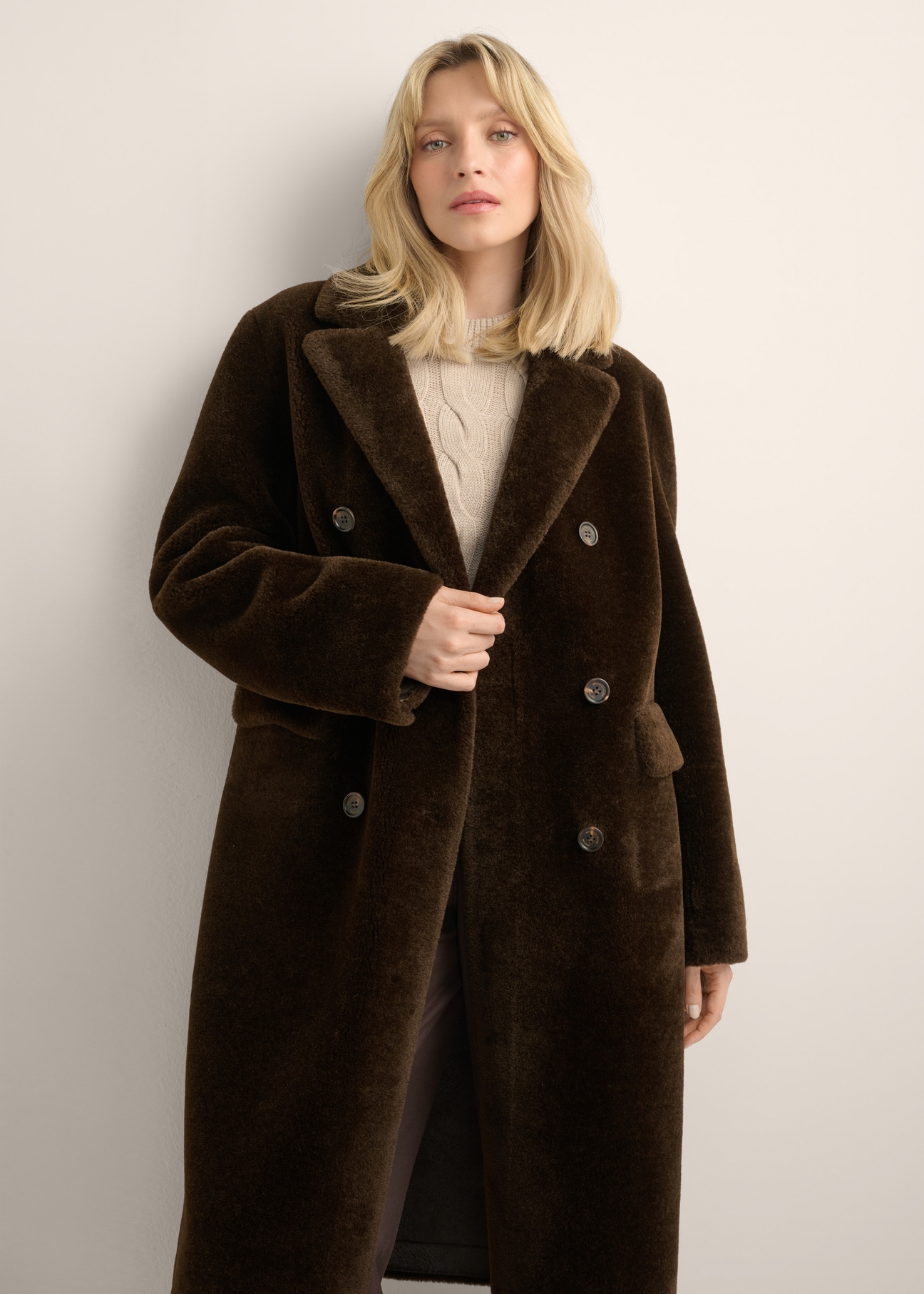 Women's brown long fur coat FUTDP-0087-1I(Z26) - back view of the product, on a model, against a light background. Half of the silhouette visible.