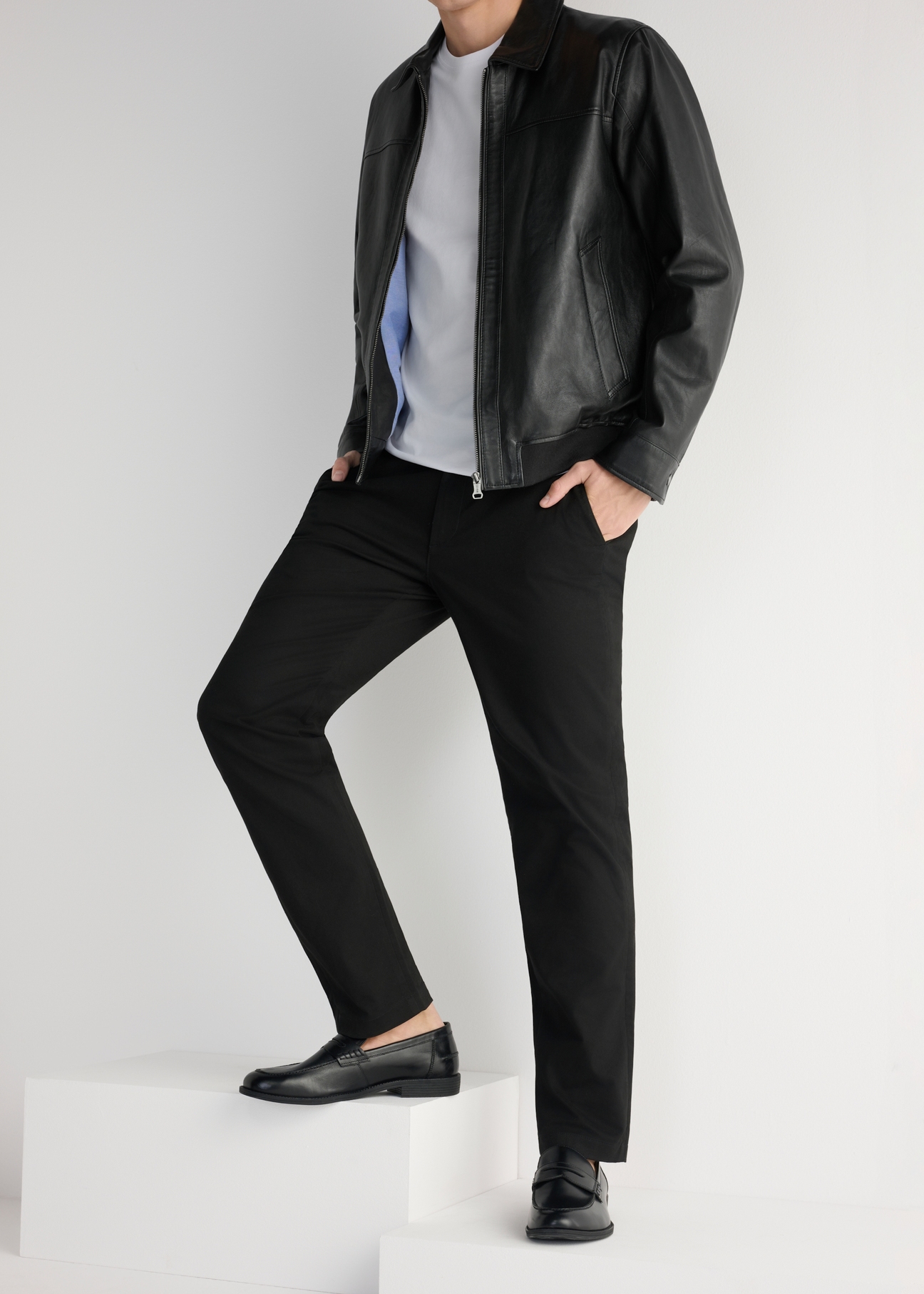 Men's black leather moccasins BUTYM-0482-99(W25), side view of the product on the model, half of the silhouette visible.