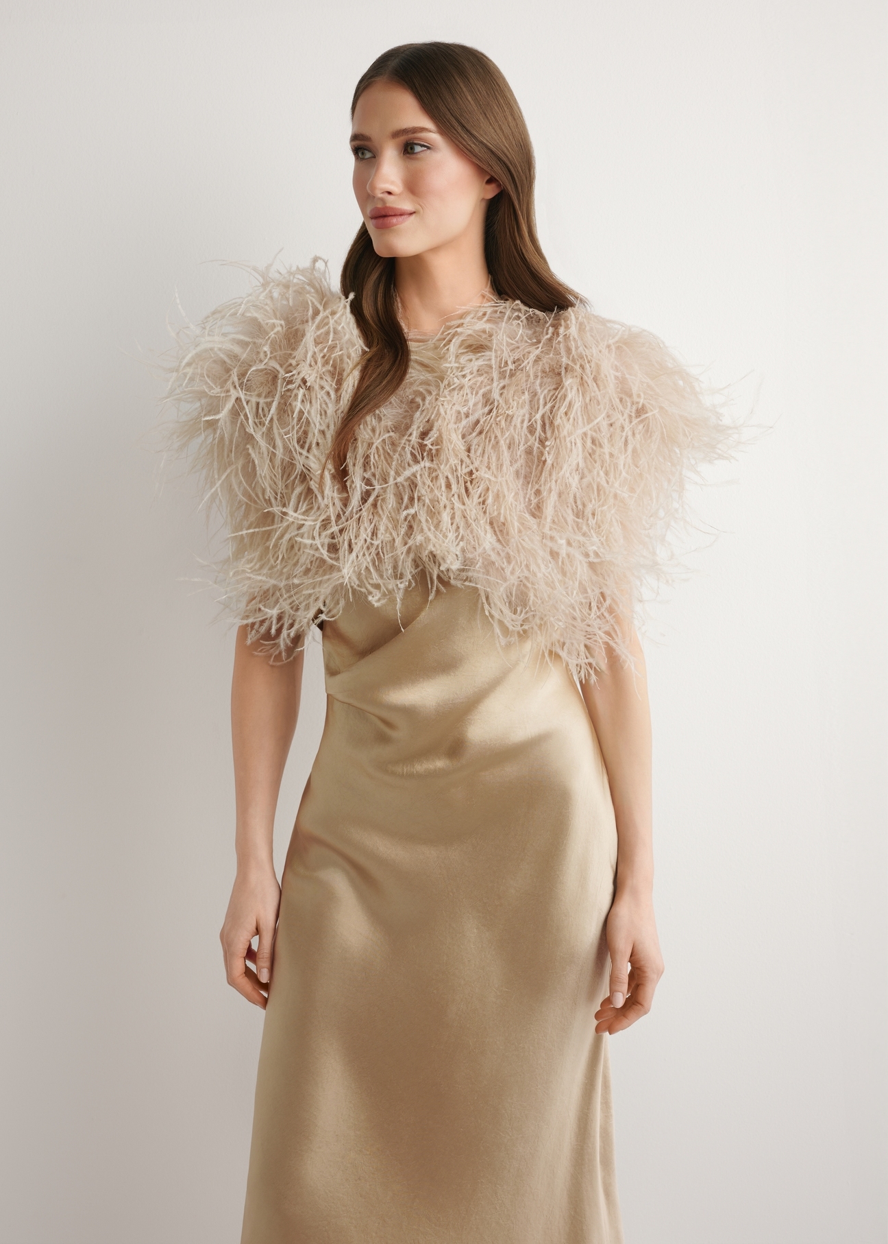 Beige natural feather cape SZADF-0036-1B(W26) - front product view, against a light background. Knee-length silhouette visible.