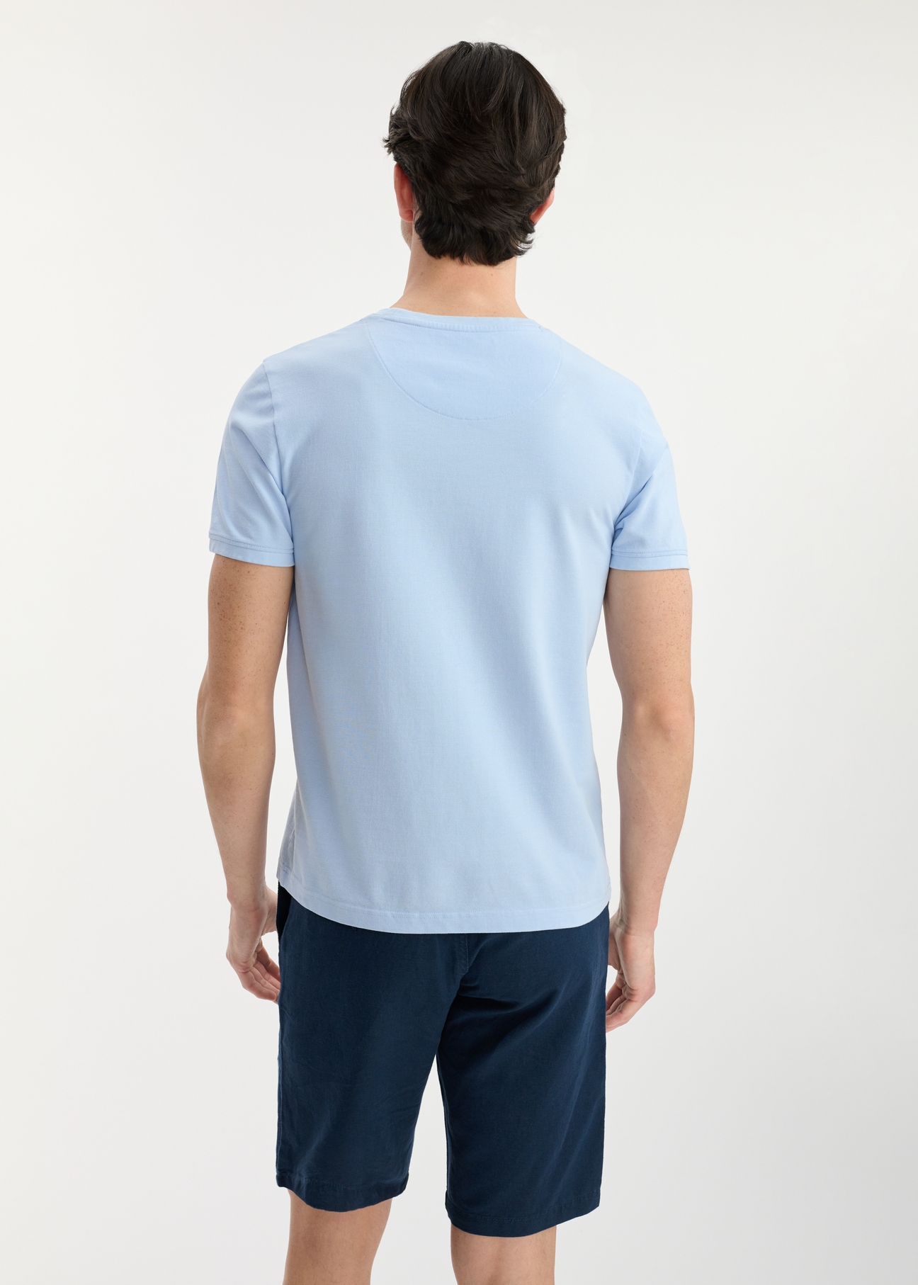 Light blue men's cotton T-shirt TSHMT-0100-60(W25), product view from the back on the model. Half of the silhouette visible.