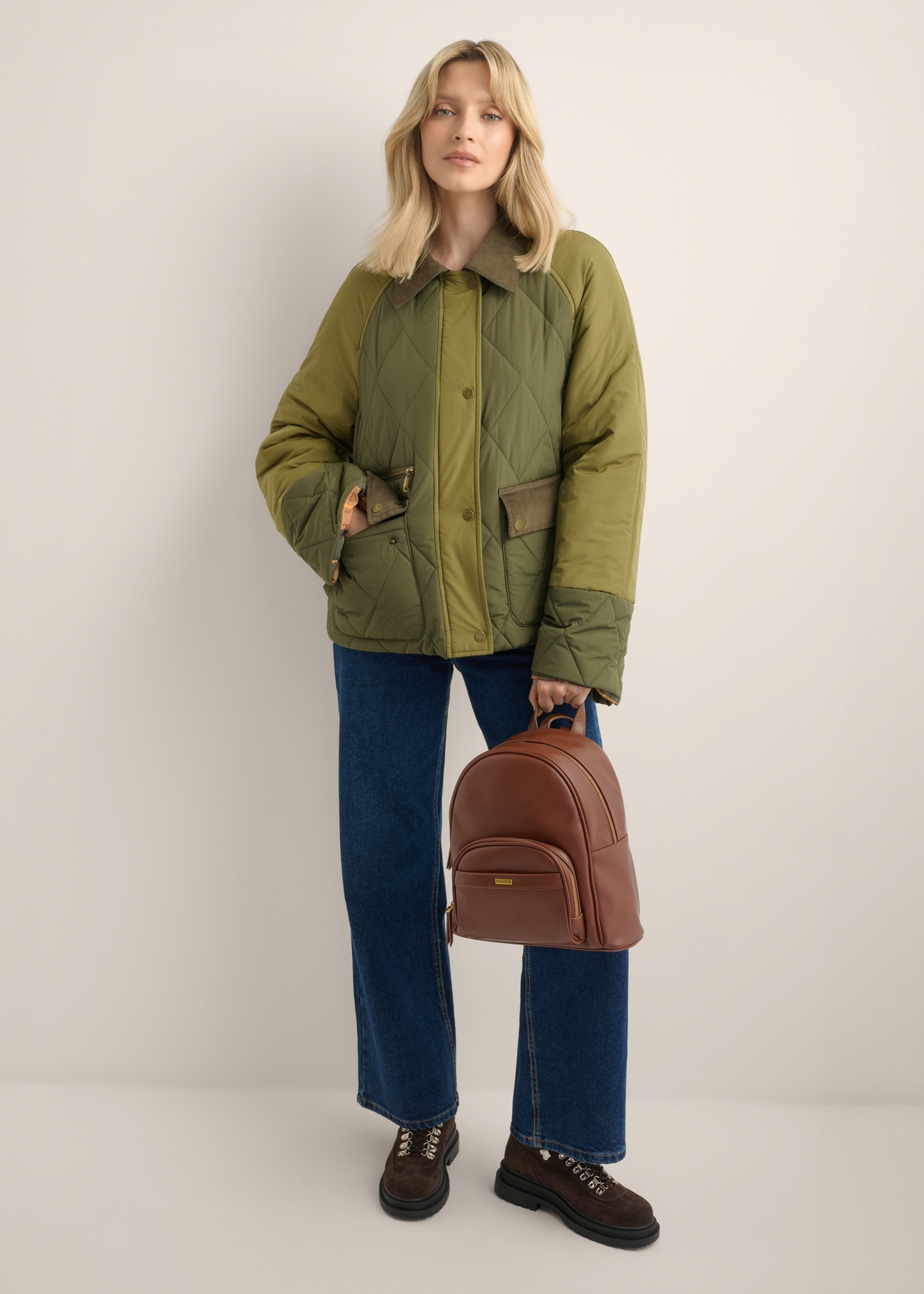 Light brown women's backpack TOREC-1263-1G(Z26), front view of the product on a model. Full body visible.