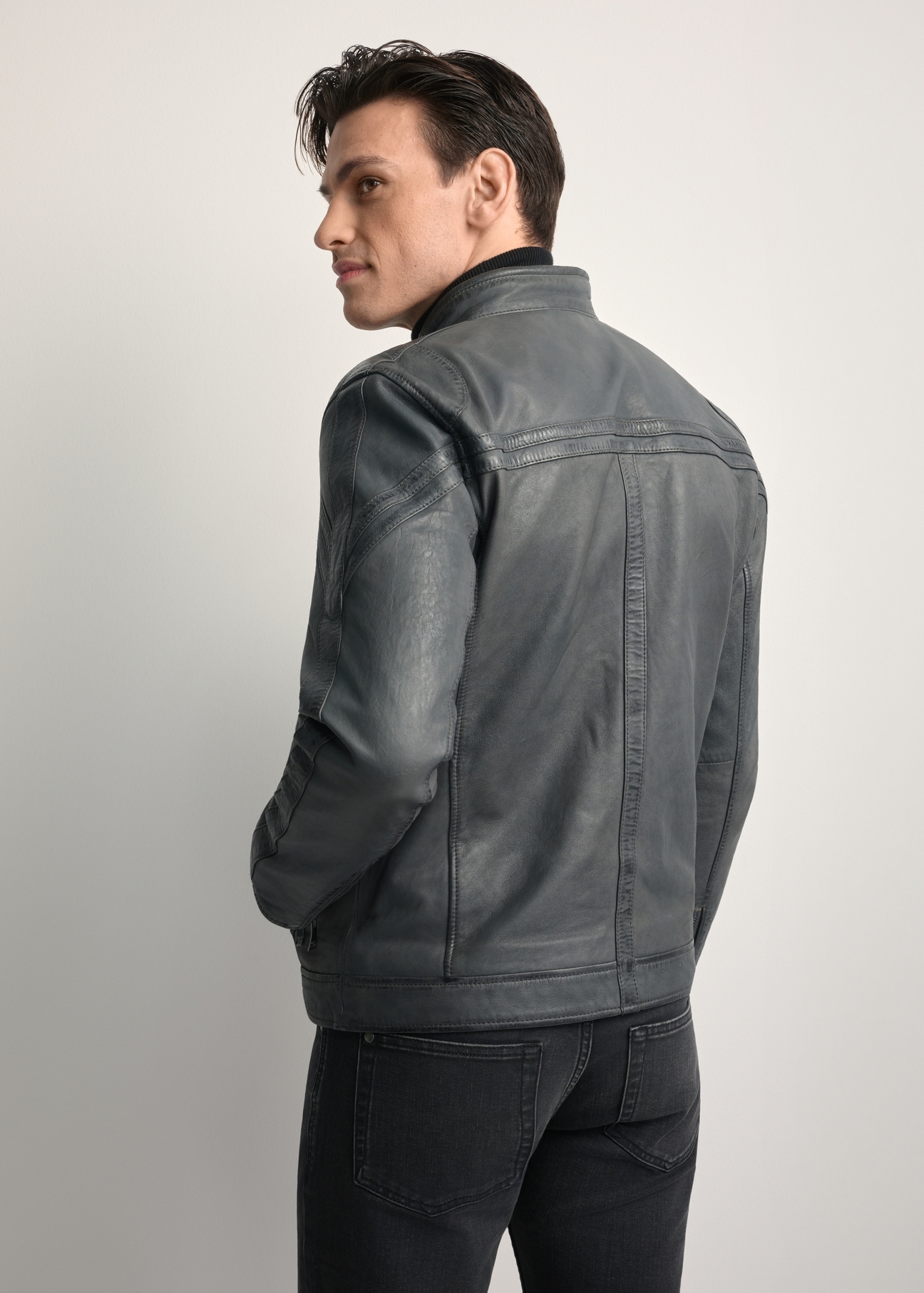 Men's graphite leather jacket KURMS-0393-9D(W26) - back view of the product, on a model, against a white background. Half of the silhouette visible.