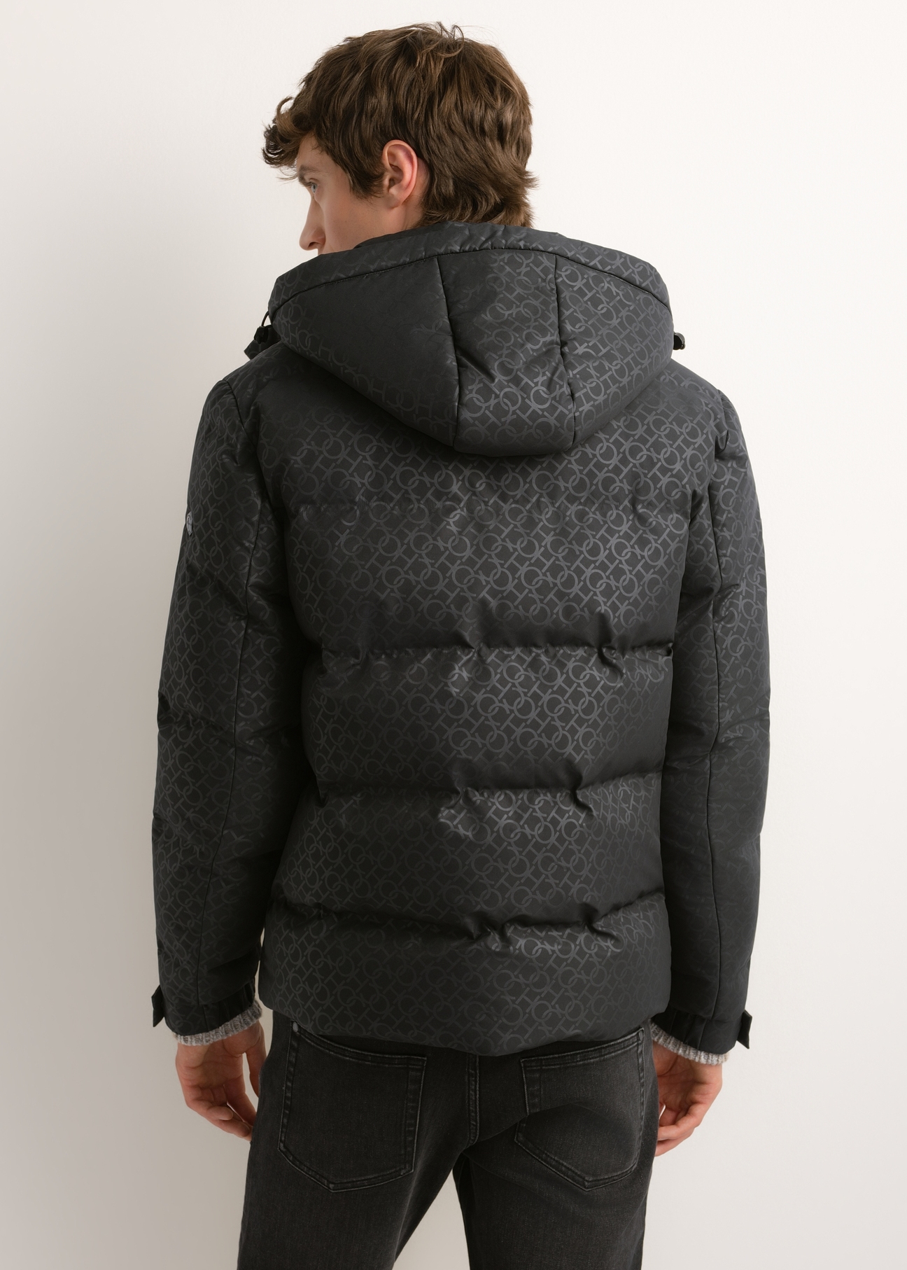 Men's dark grey monogram jacket KURMT-0444-9P(Z26), rear view on a model. Half of the figure is visible.