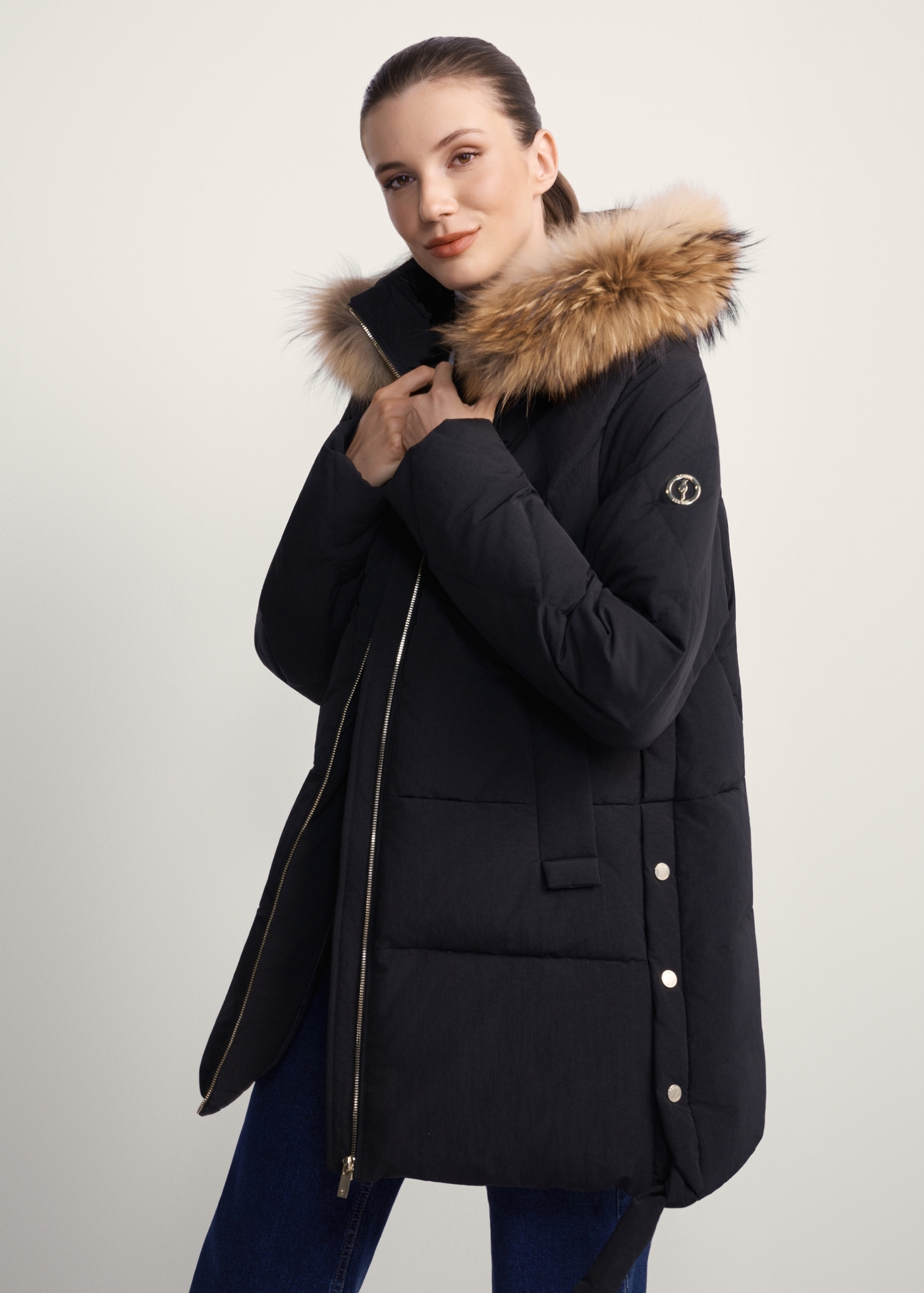 Black women's jacket with fur KURDT-0480-99(Z25), diagonal view of the product on the model, half of the silhouette visible.