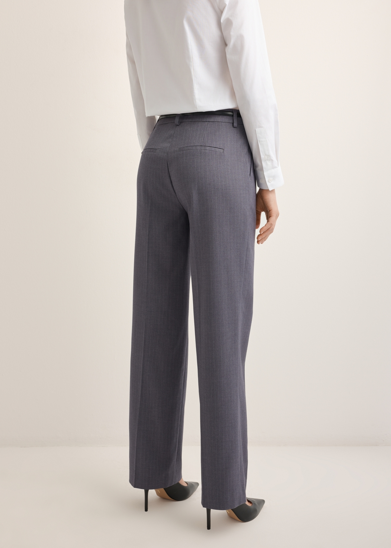 Women's gray pleated trousers SPODT-0125-9D(Z26), side view of the product on the model. Half of the silhouette visible.