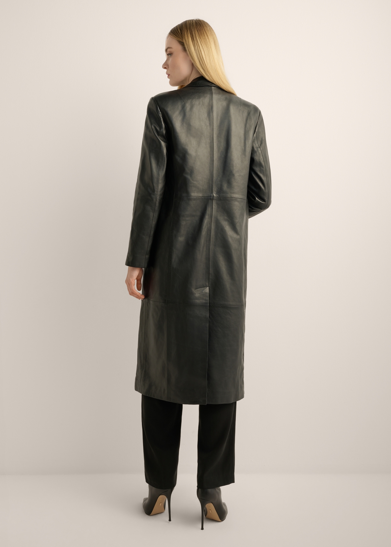 Women's leather coat KURDS-0639-99(Z26). Back view of the product on a model. The entire silhouette is visible.