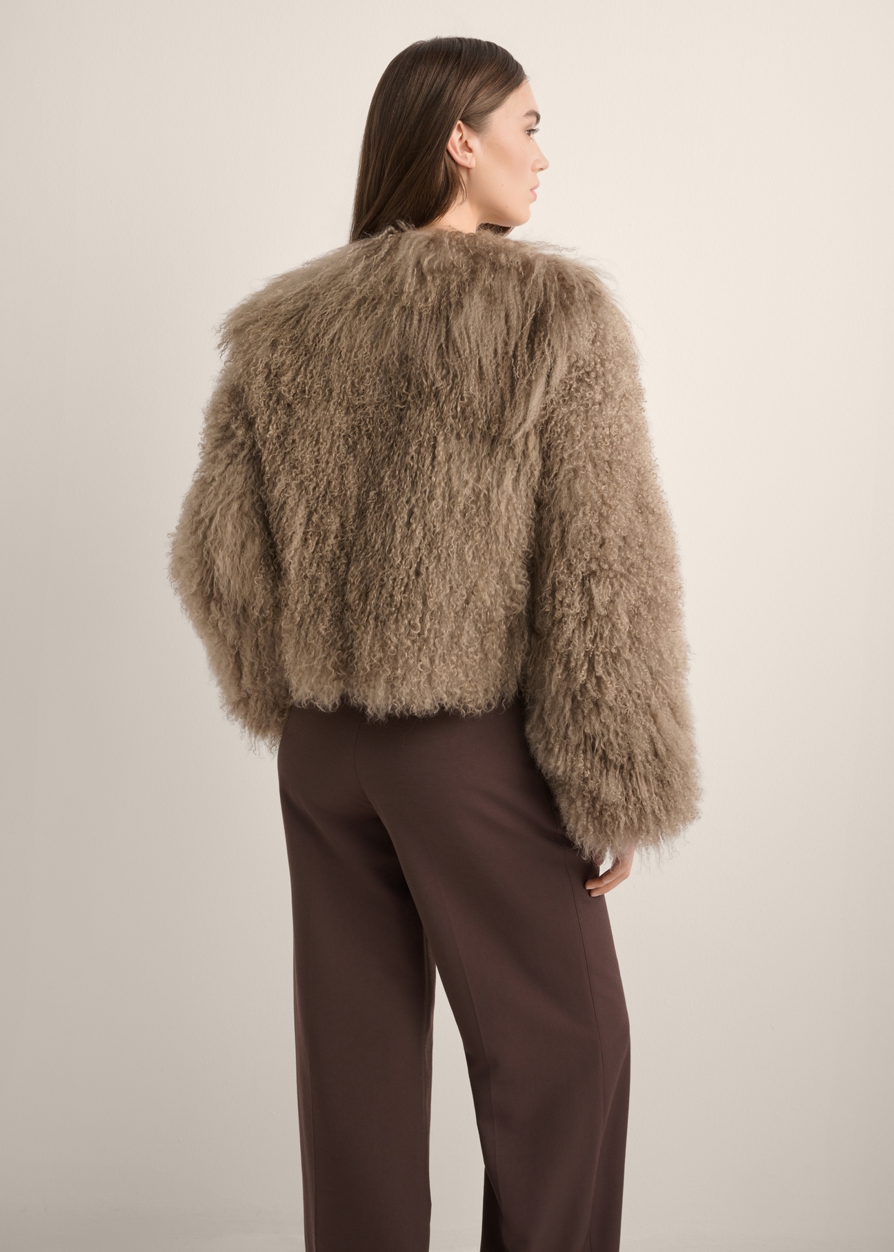 Brown short natural fur coat FUTDF-0104-1K(Z26), product view from the back on the model. Half of the silhouette visible.