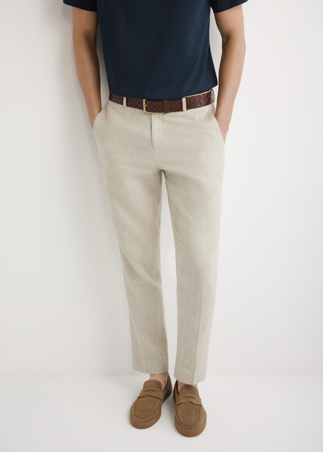 Men's beige herringbone suit trousers SPOMT-0117-1B(W26), front view of the product on the model. Half of the silhouette visible.