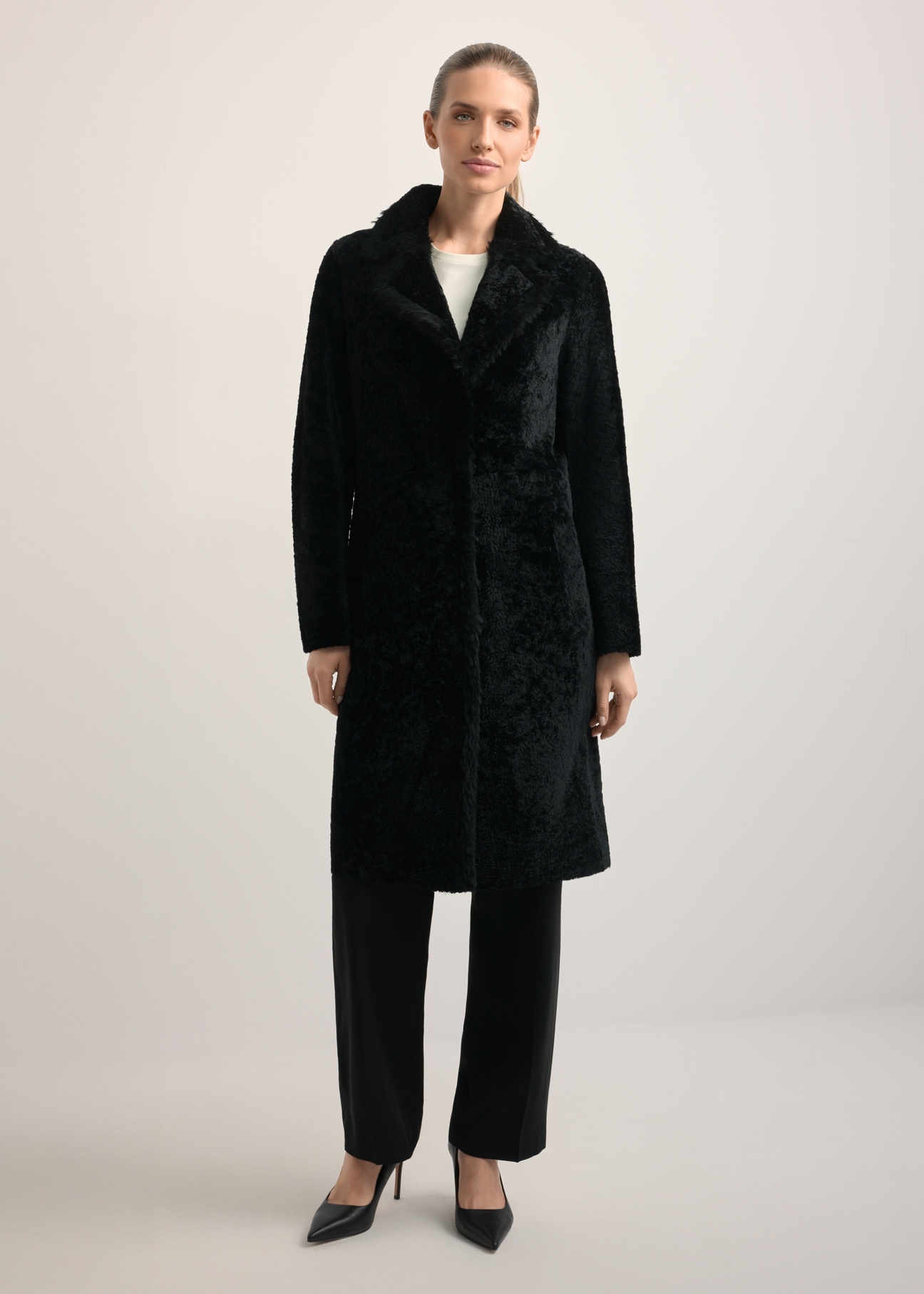 Women's sheepskin coat with snap closure KOZDS-0056-1180(Z25), front view of the product on the model. Full body visible.