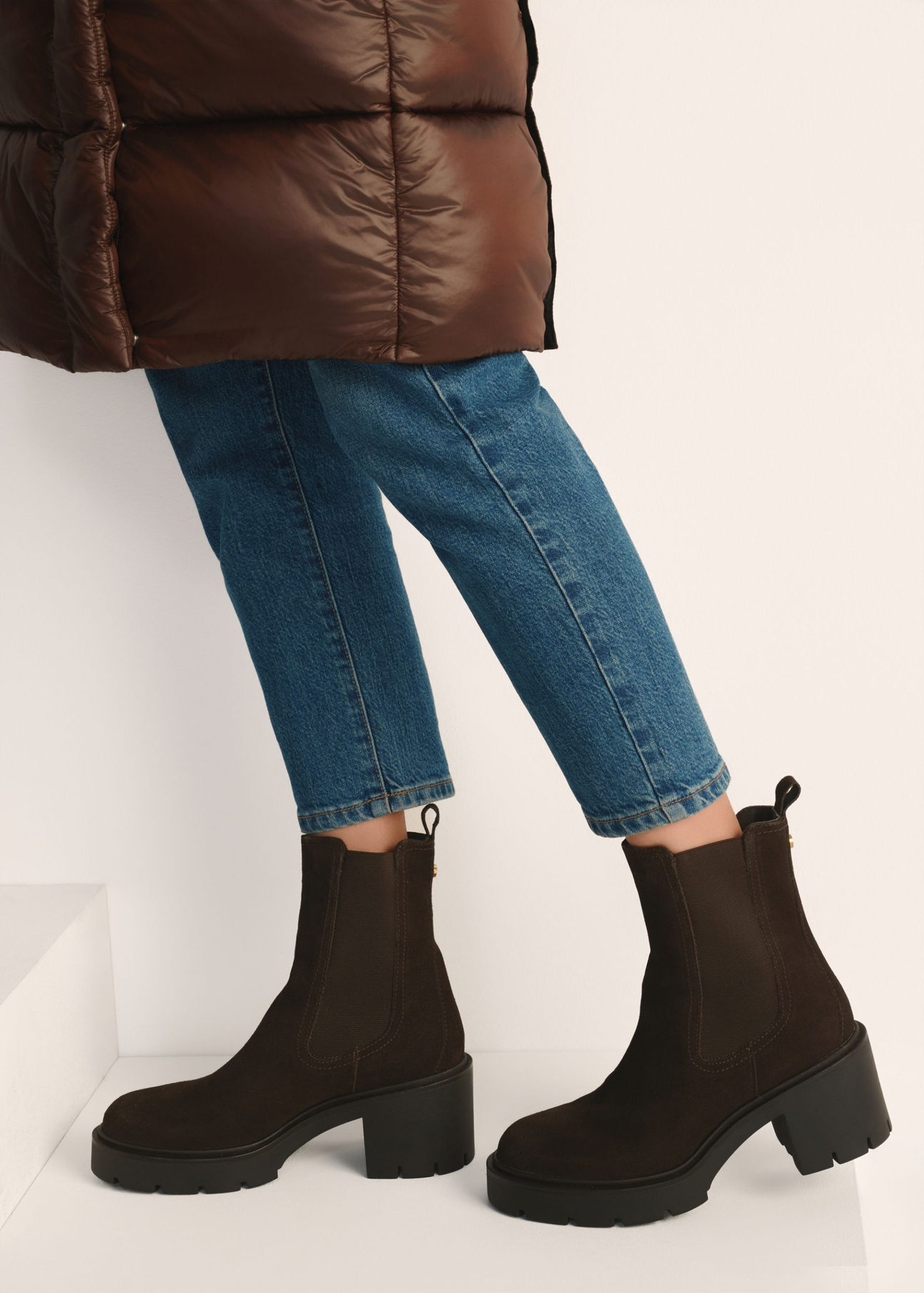 Women's dark brown suede heeled ankle boots BUTYD-1094-1I(Z26) - side view of the product on a model against a white background. Knee-length silhouette visible.