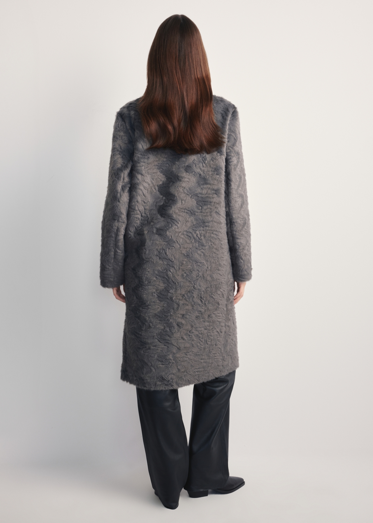 Gray long women's fur coat FUTDP-0066-96(Z25) product view from the back on a model on a white background. The entire silhouette is visible.