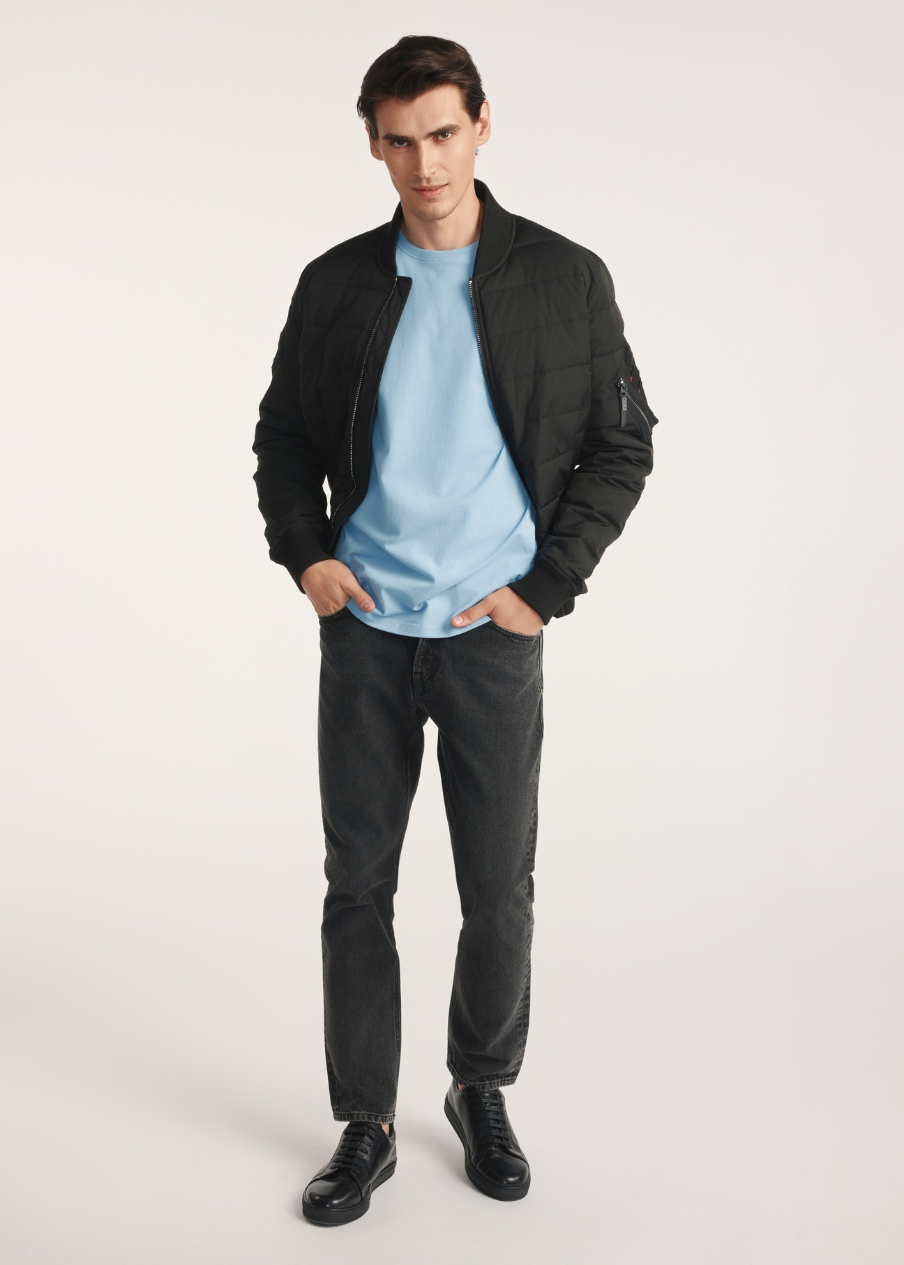 Black insulated men's bomber jacket KURMT-0362-99(Z25), product visible from the front on the model, the entire silhouette is visible.