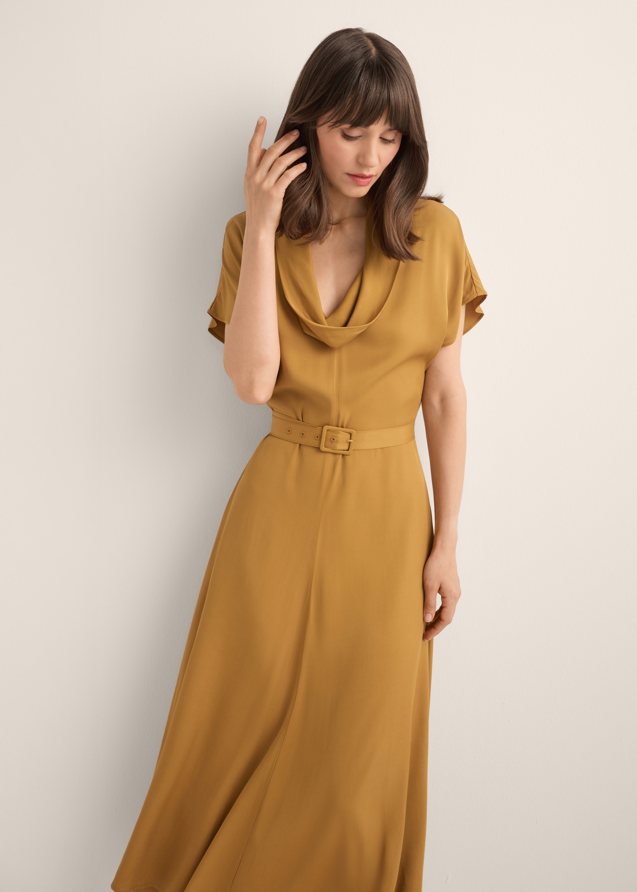 Mustard modal dress SUKDT-0287-2D(Z26), front view of the product on the model. Half of the silhouette visible.