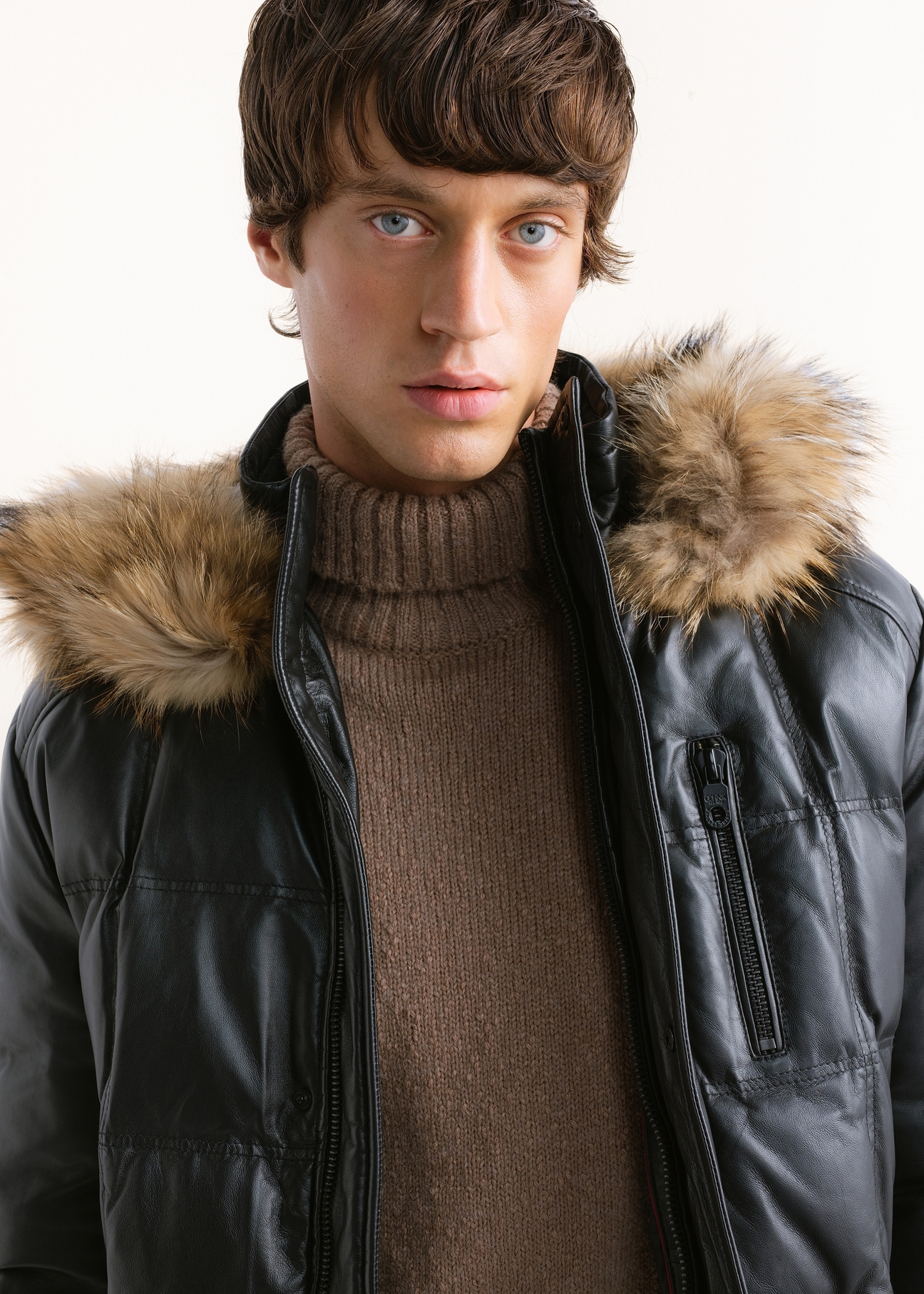 Men's black insulated leather jacket (KURMS-0348-99(Z26)), close-up of the product worn by a model, against a light background.