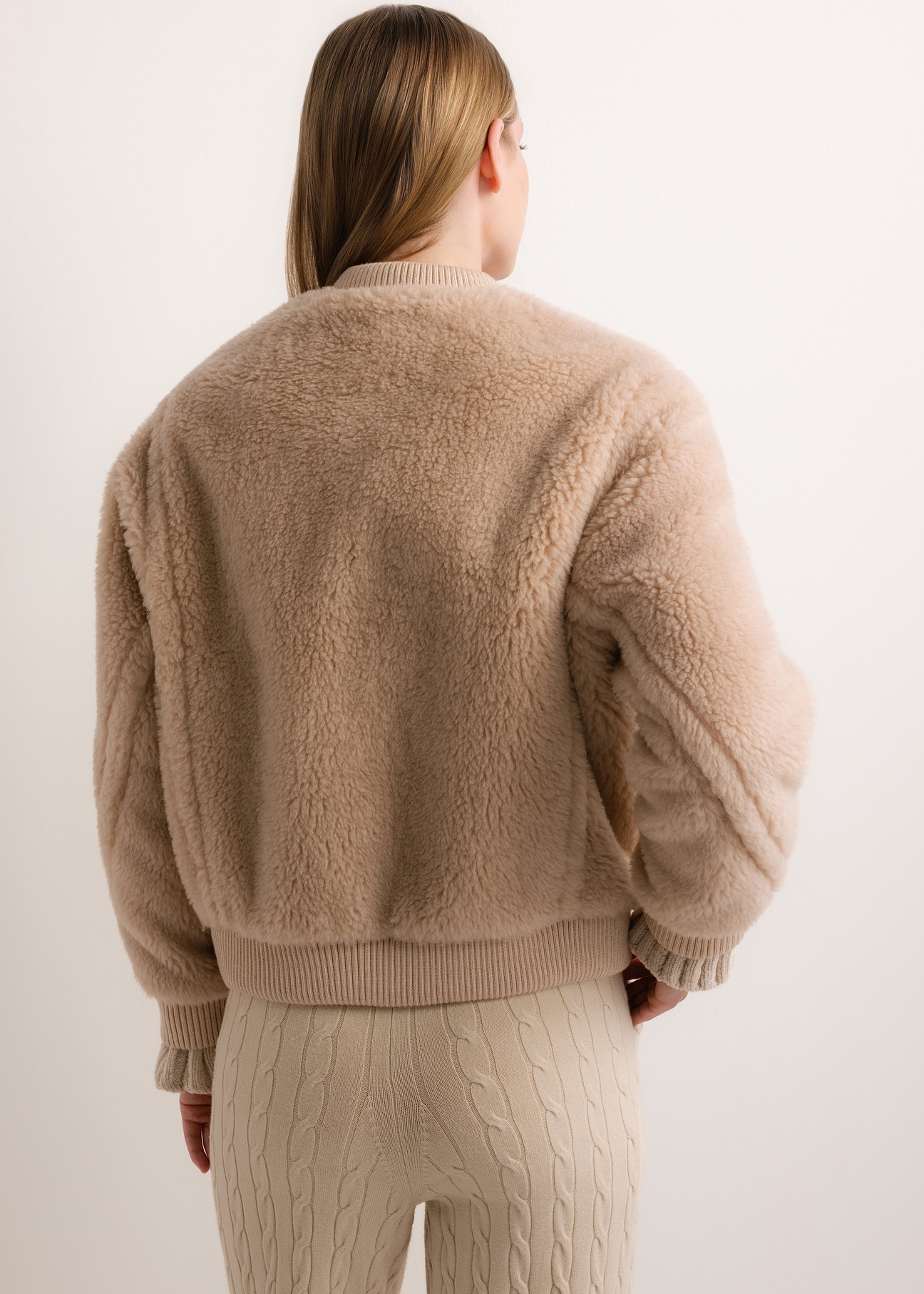 Beige short women's wool fur coat FUTDW-0045-1B(Z26), product view from the back on the model. Half of the silhouette visible.