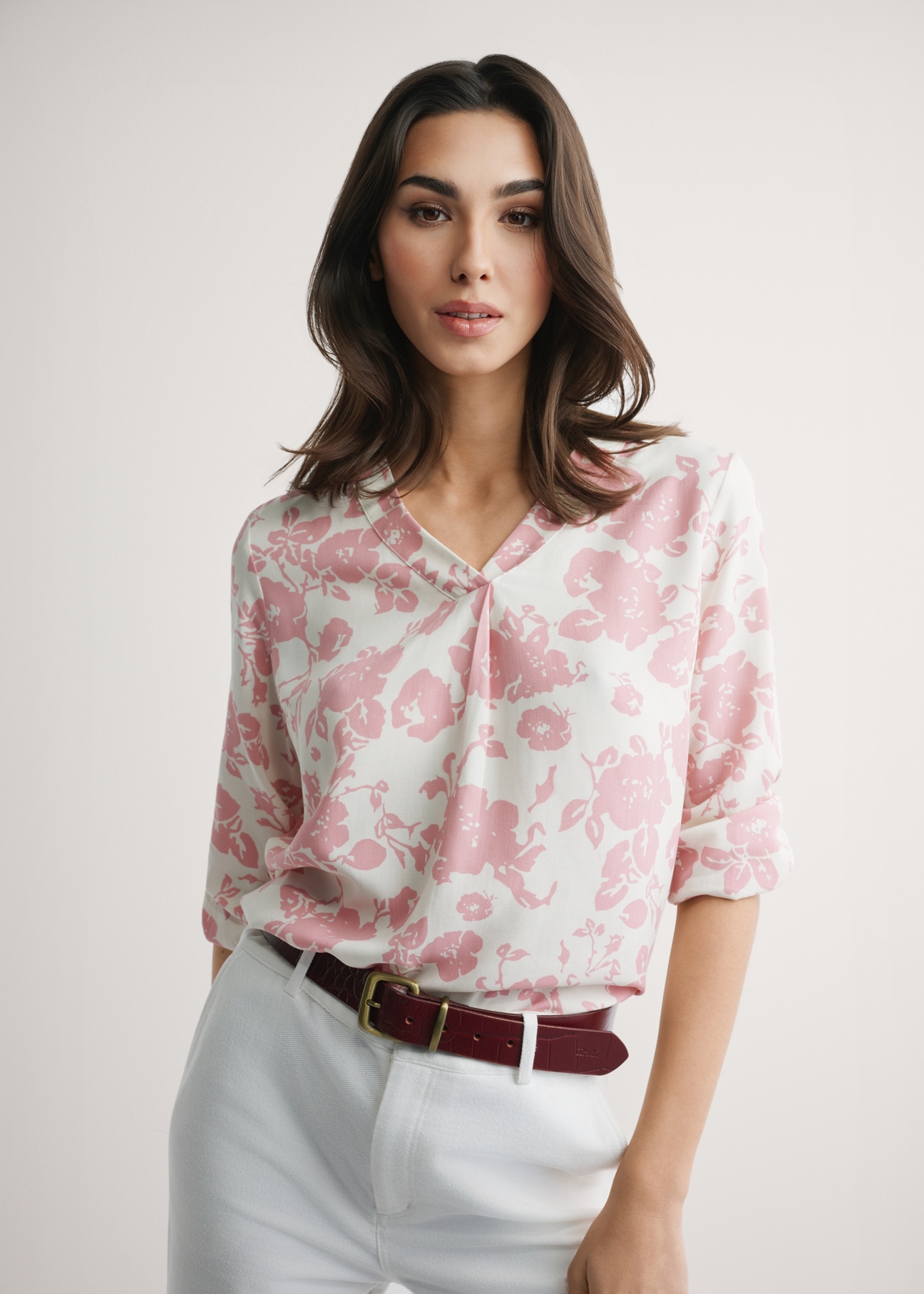 Women's pink floral blouse BLUDT-0172A-5P(W26), front view of the product on the model. Half of the silhouette visible.