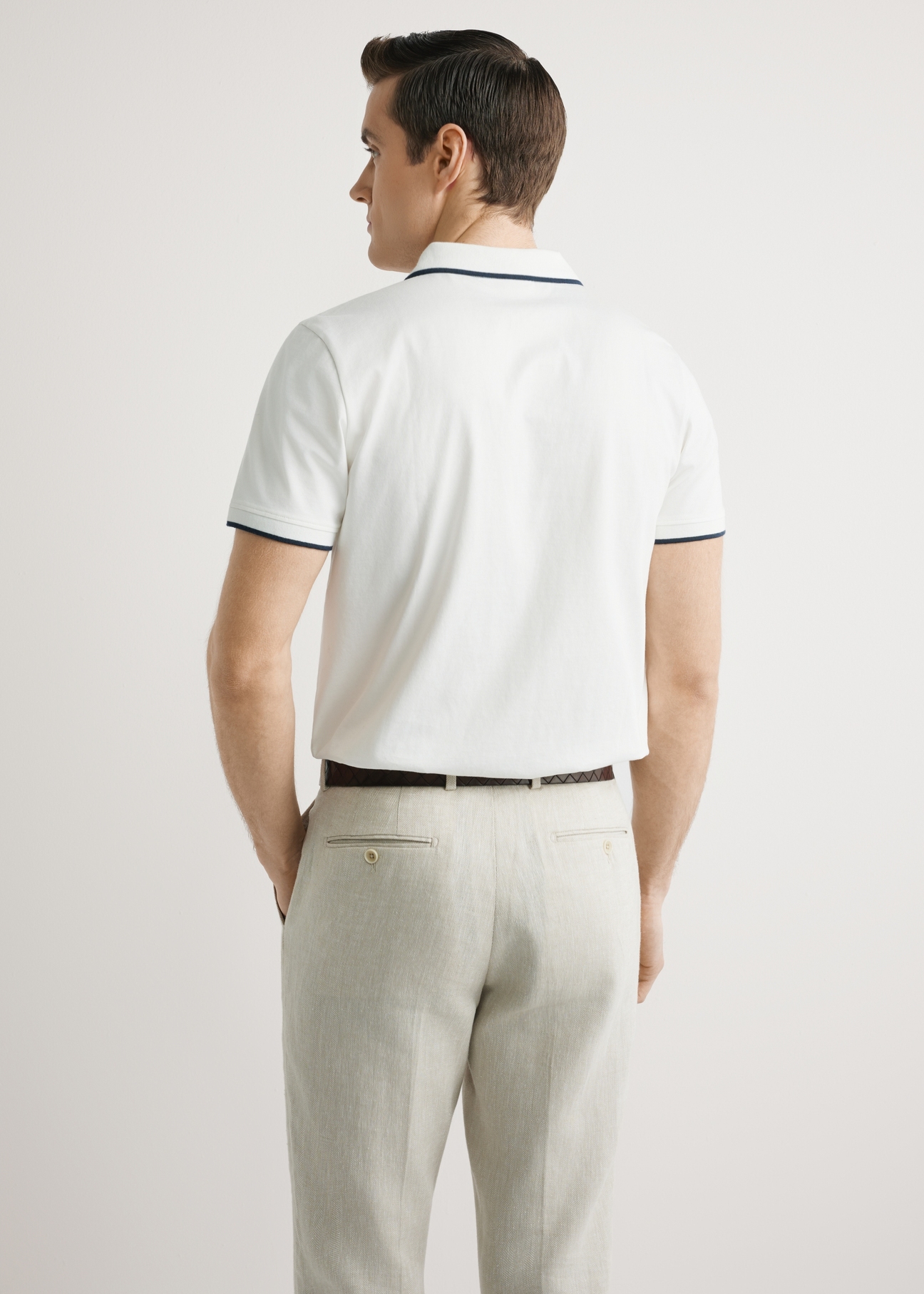 Men's cream polo shirt POLMT-0092-0B(W26), back view of the product on the model. Half of the silhouette visible.