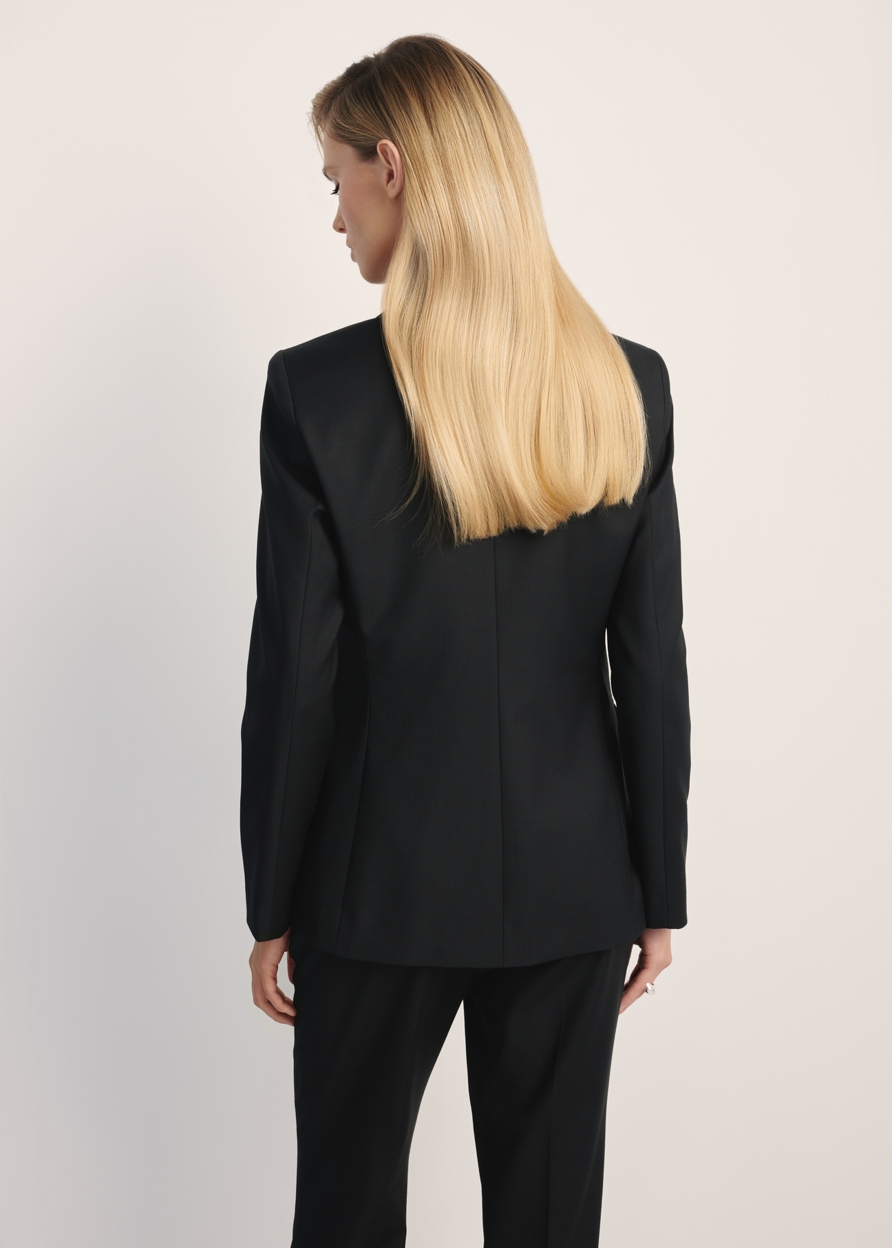 Black women's jacket ZAKDT-0045-99(Z25) - product view from the back on the model. Half of the silhouette visible.