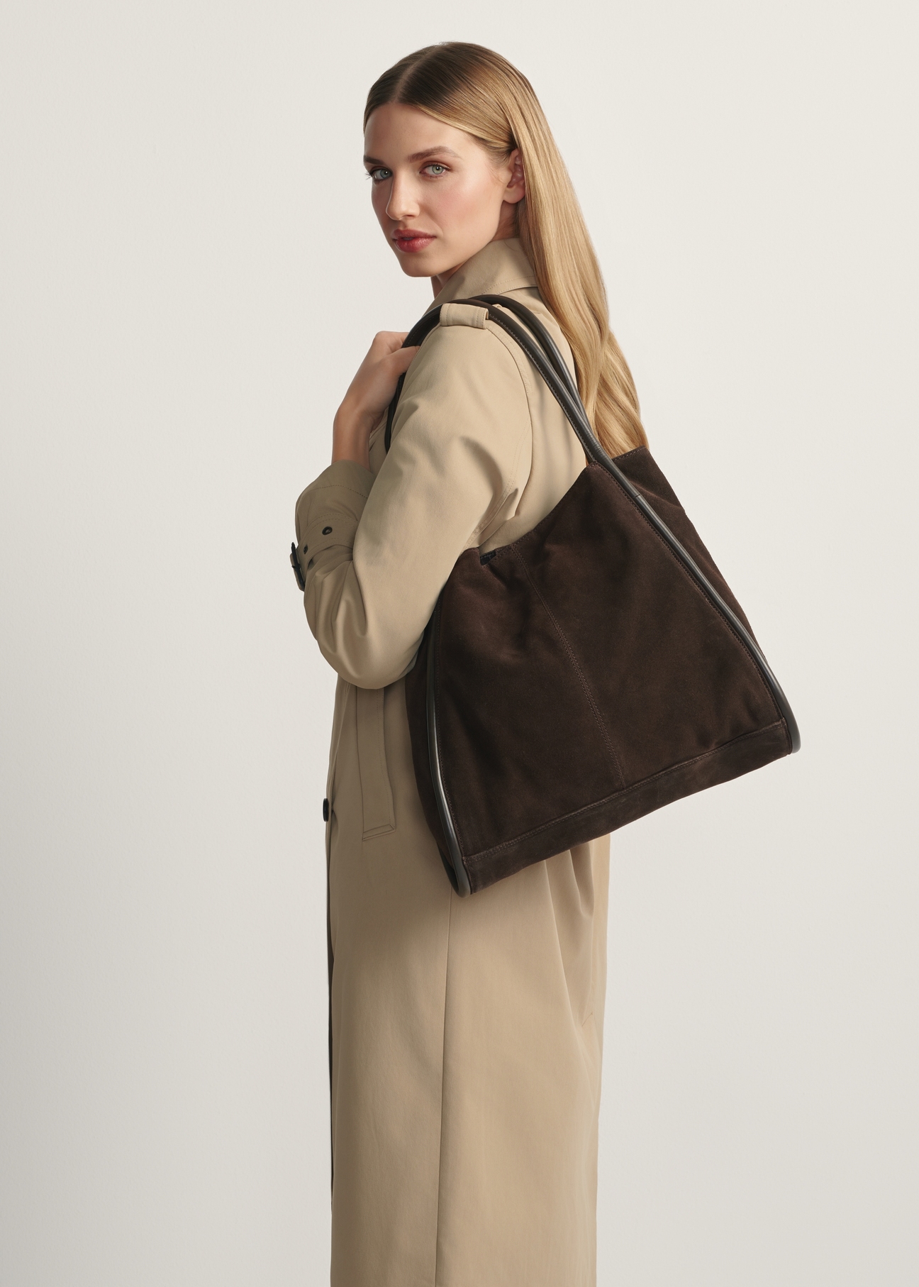 Large brown suede women's handbag TORES-1250-1I(W26) - front view of the product, on a model, against a light background. Knee-length silhouette visible.