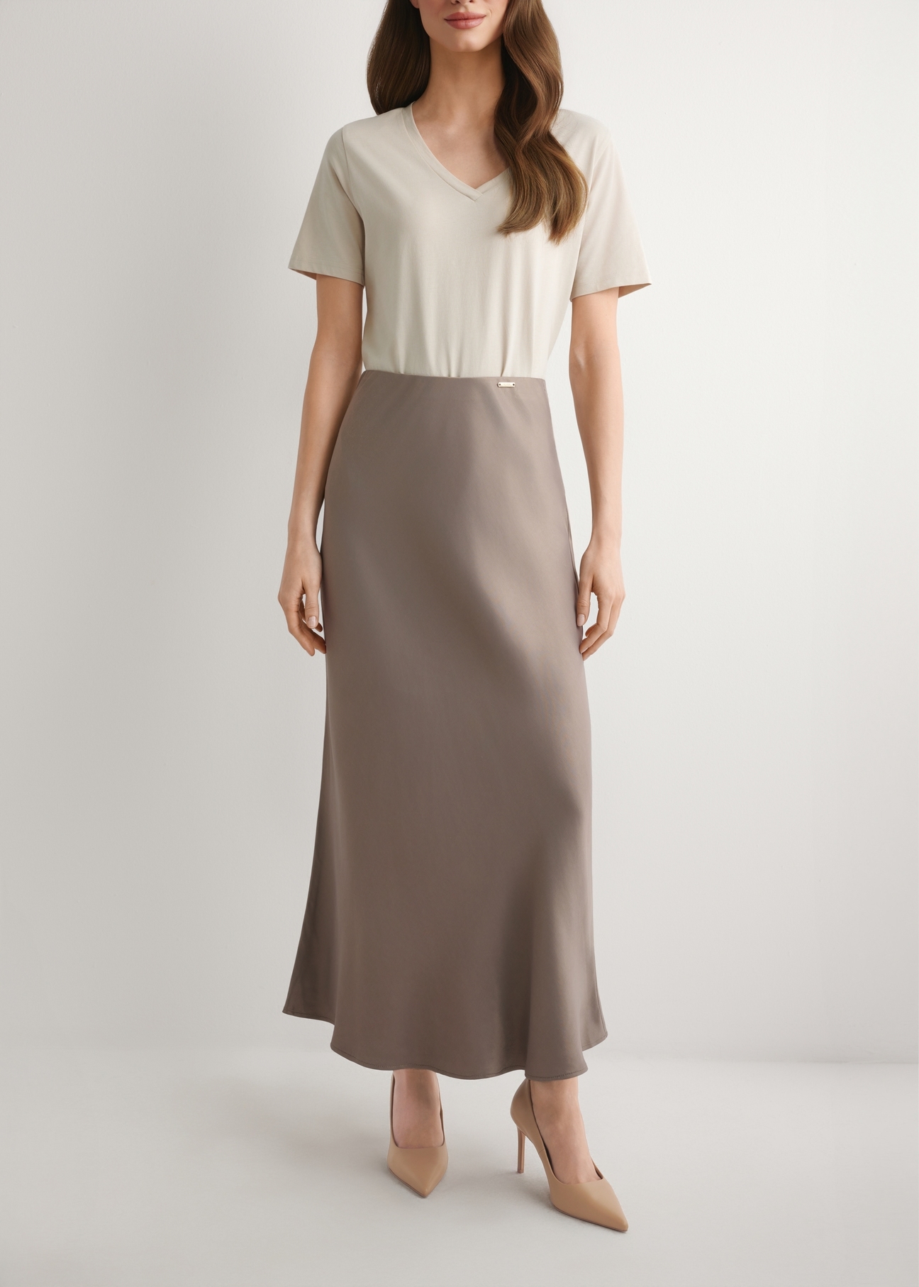 Brown women's skirt SPCDT-0122-1K(W26), front view of the product on the model. Half of the silhouette visible.
