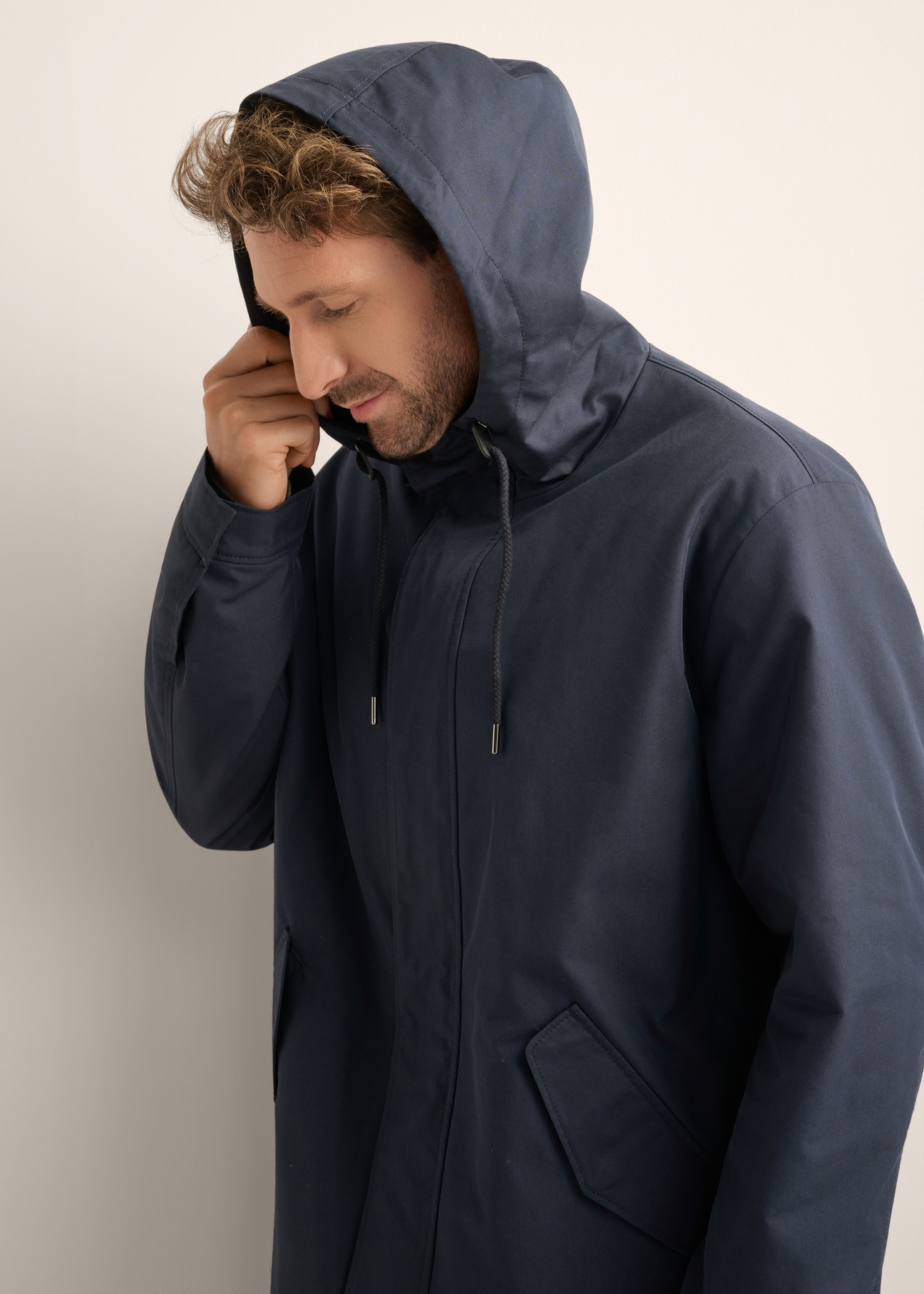 Men's navy blue transitional jacket KURMT-0425-7D(Z26), front product view on model. Half silhouette visible.