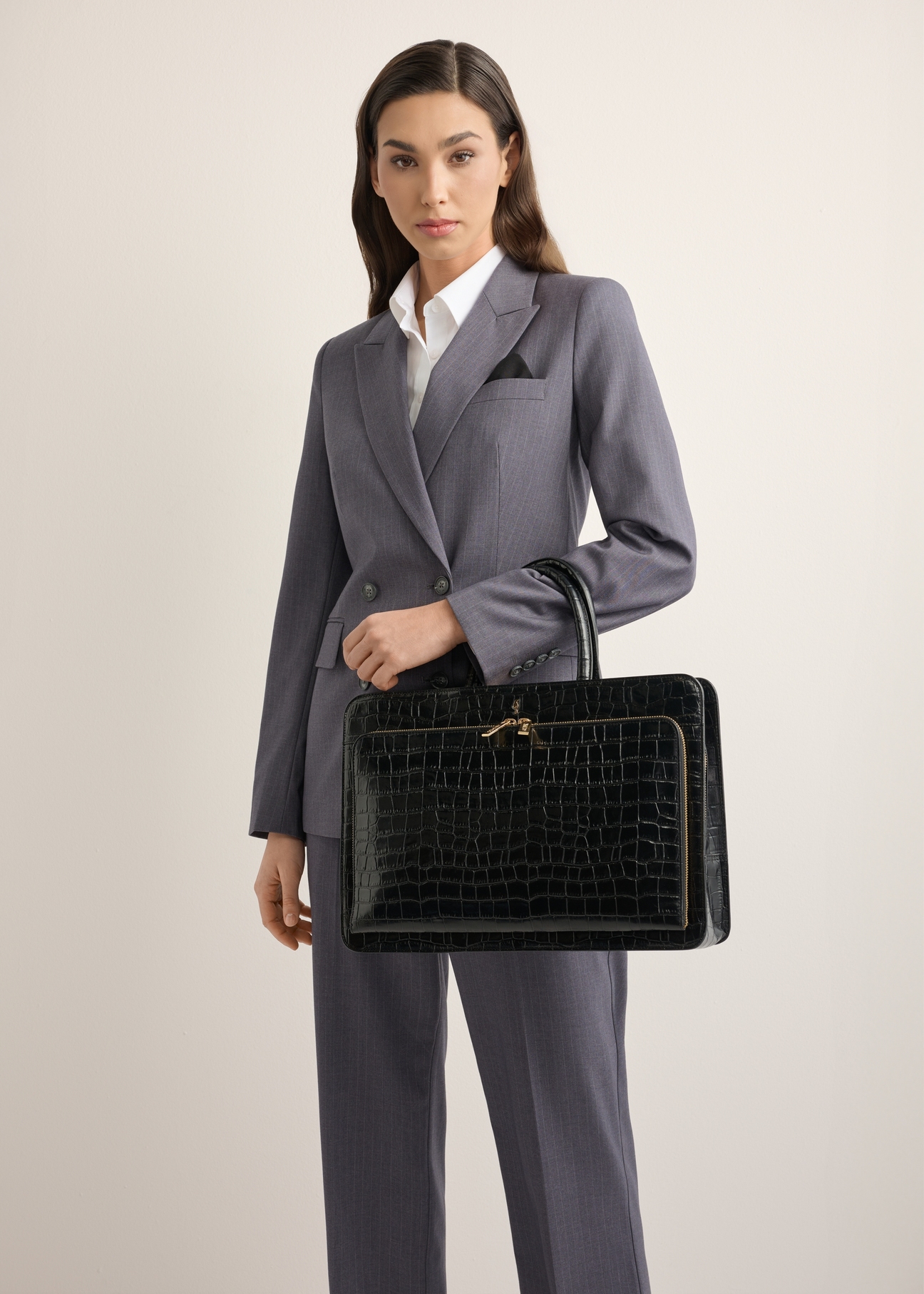 Leather black croco laptop bag TORES-1321-9G(Z26), product view on the model's shoulder, half of the silhouette visible.