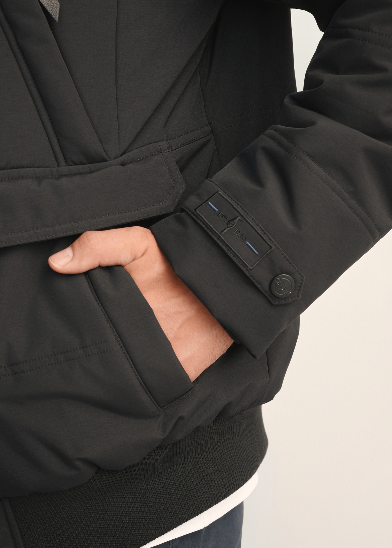 Black men's winter jacket KURMT-0273-99(Z25) - close-up detail, on white background.