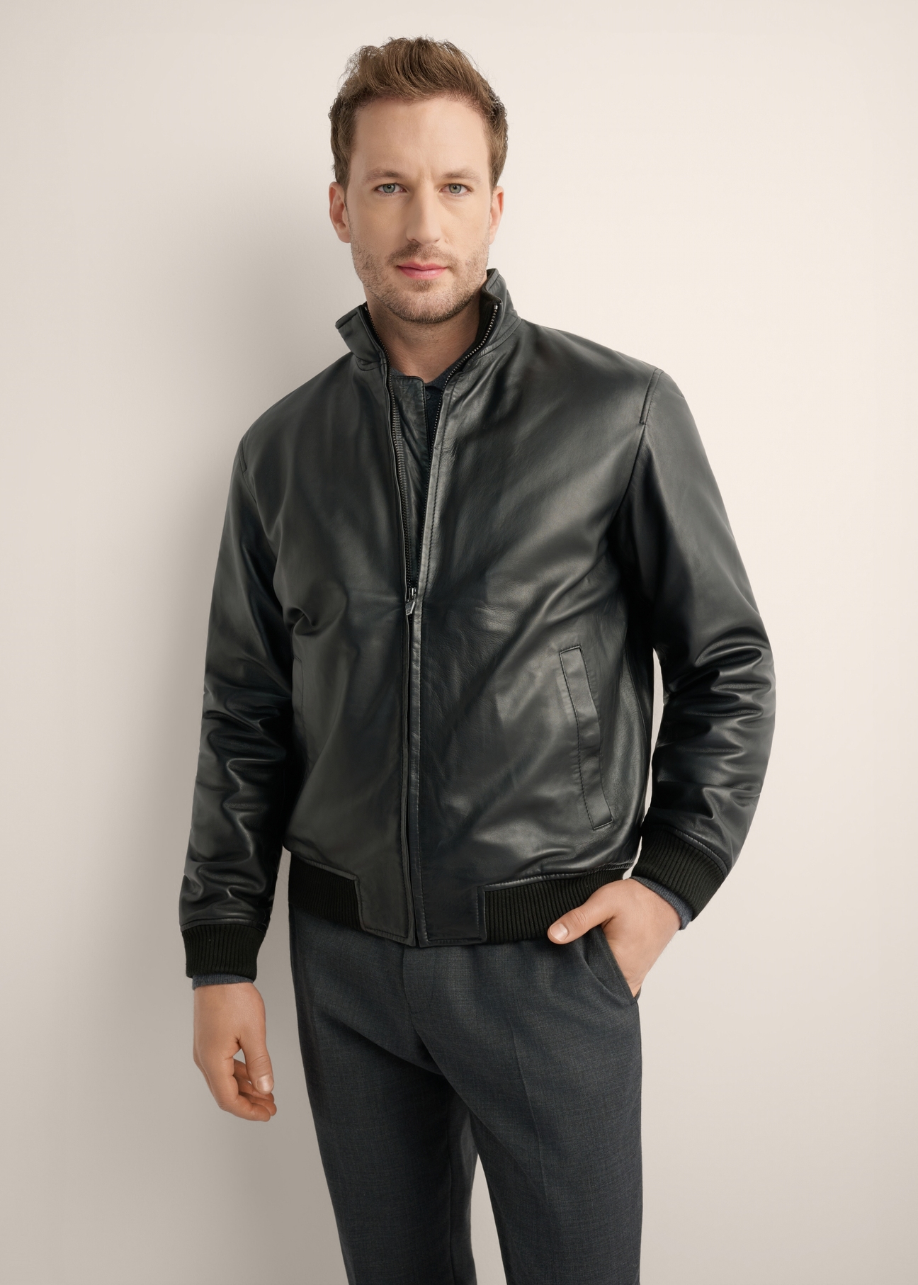 Men's black leather bomber jacket KURMS-0418-99(Z26), front product view on model. Half silhouette visible.