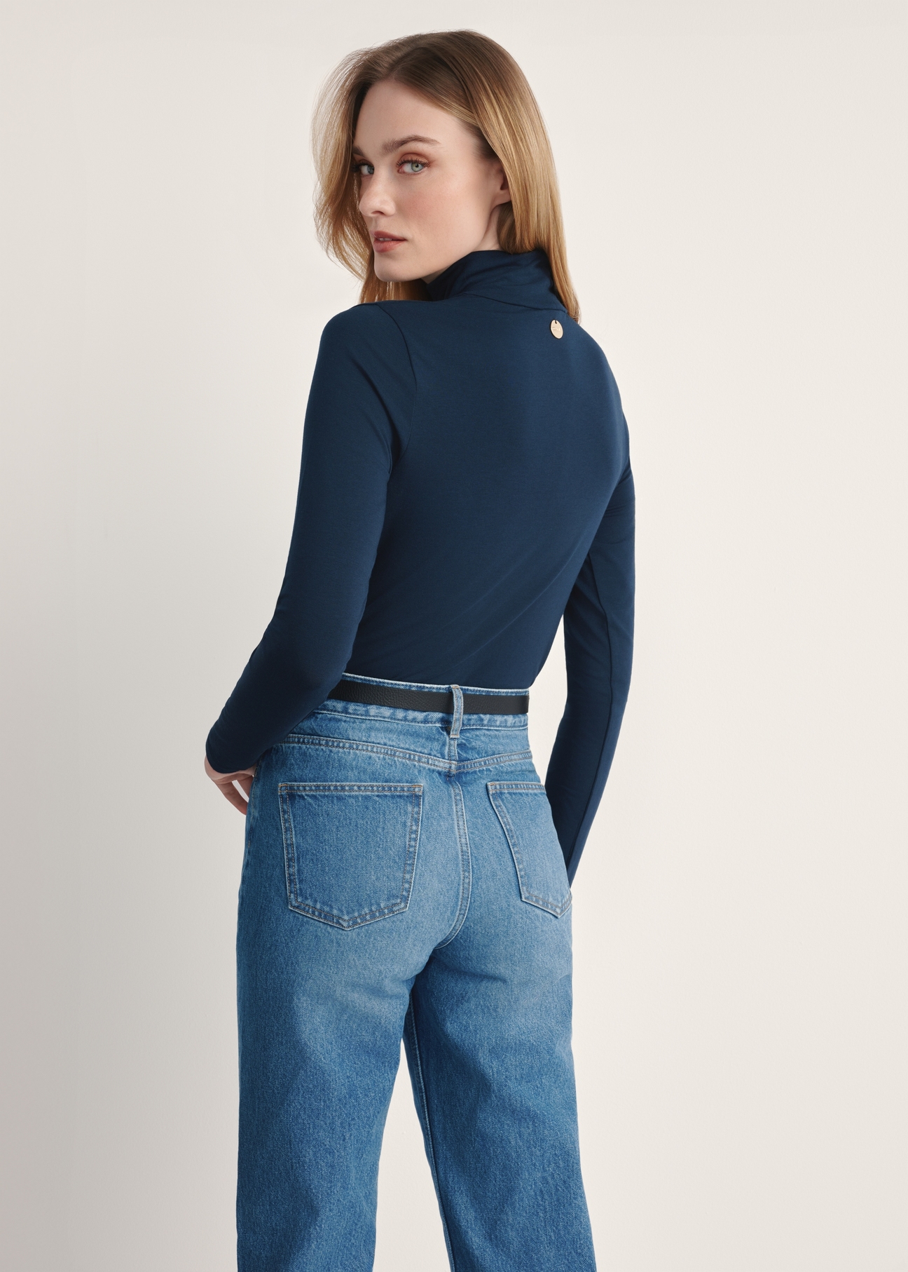 Navy blue women's turtleneck blouse LSLDT-0040-68(Z25), product visible from the back on the model, half of the silhouette visible.