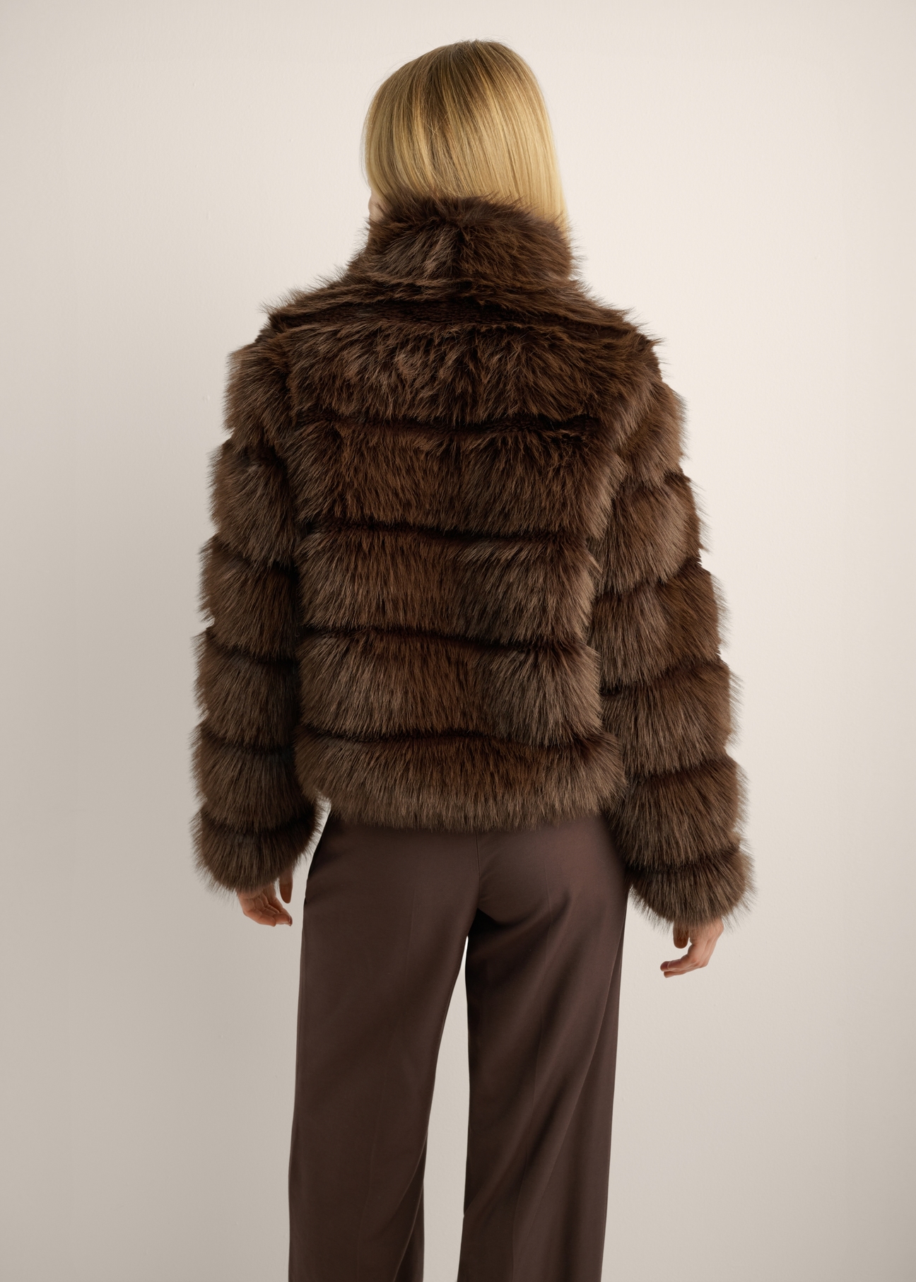 Women's short dark brown fur coat FUTDP-0085-1I(Z26) - back view of the product on a model, against a light background. Knee-length silhouette visible.