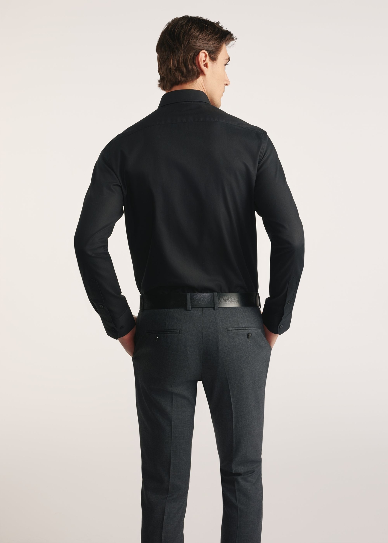 Black men's shirt KOSMT-0351A-99(Z26) - product view from the back on the model on a white background. Half of the silhouette visible.