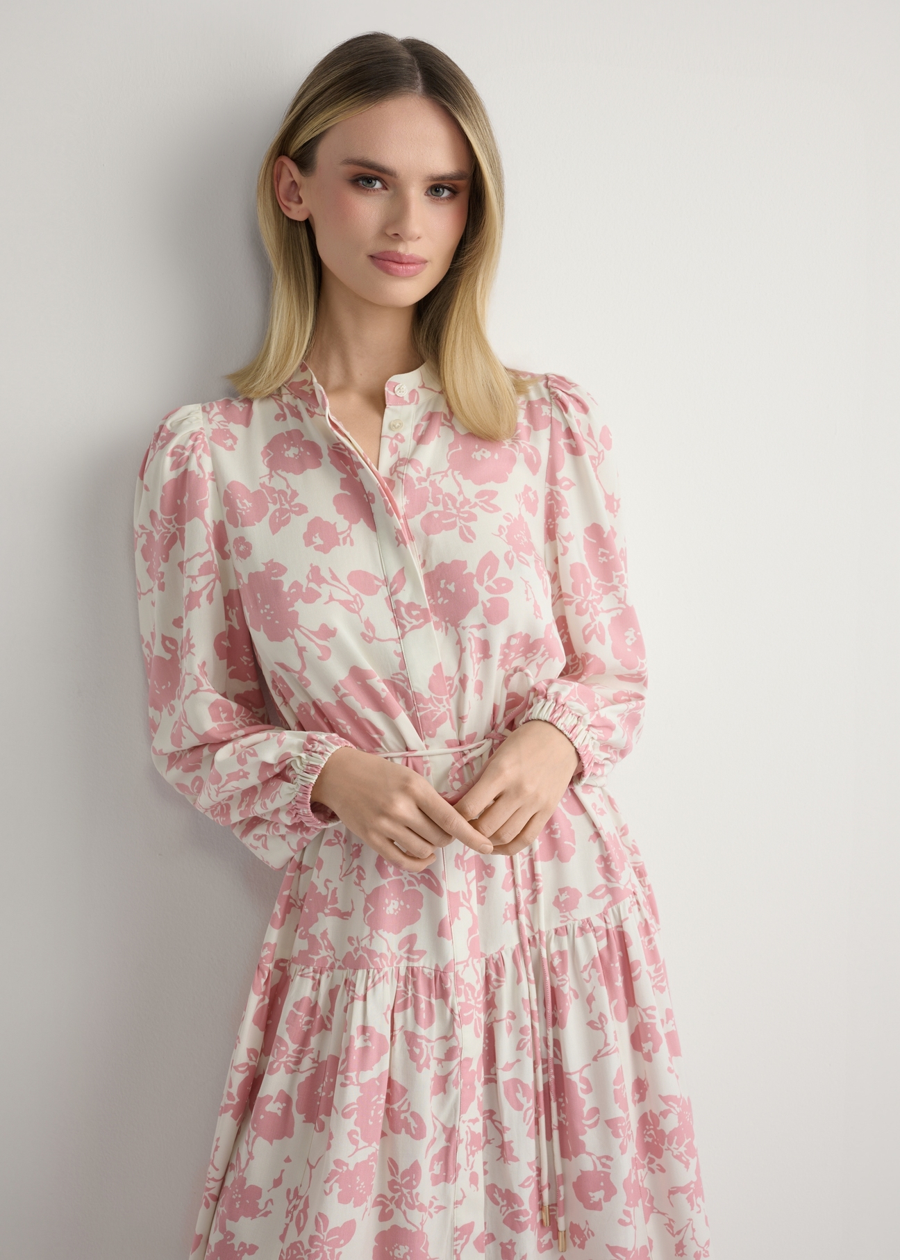 Pink floral midi dress SUKDT-0270-5P(W26), front view of the product on the model. Half of the silhouette visible.