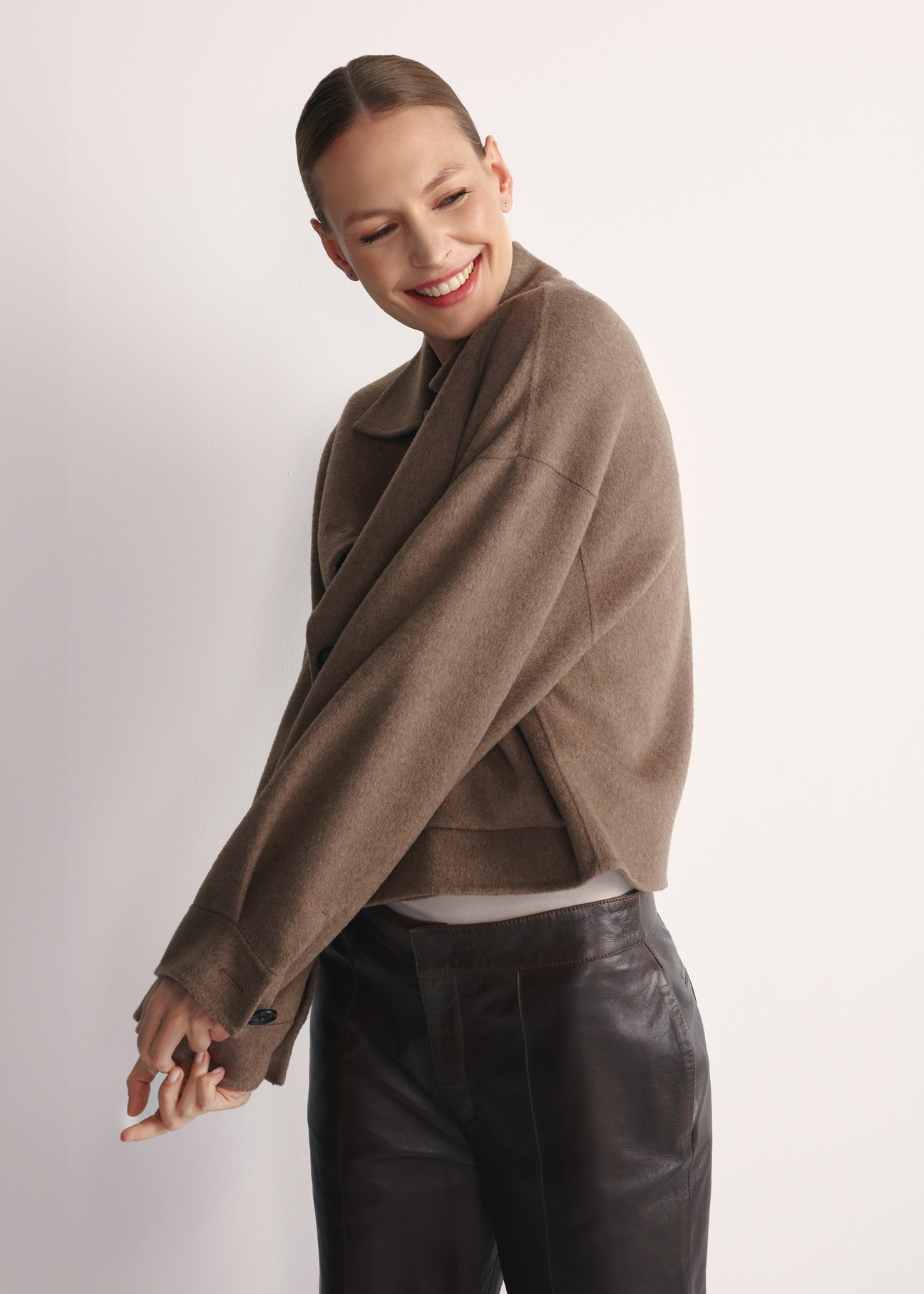 Women's short coat PLADT-0067-82(Z25), front view of the product on the model. Half of the silhouette visible.