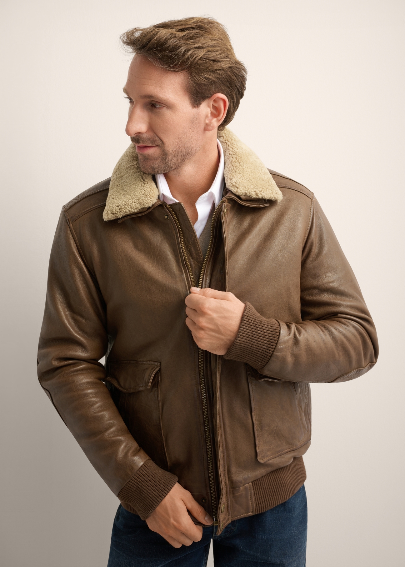 Men's brown leather bomber jacket KURMS-0424-1K(Z26), close-up of the product on the model's silhouette.