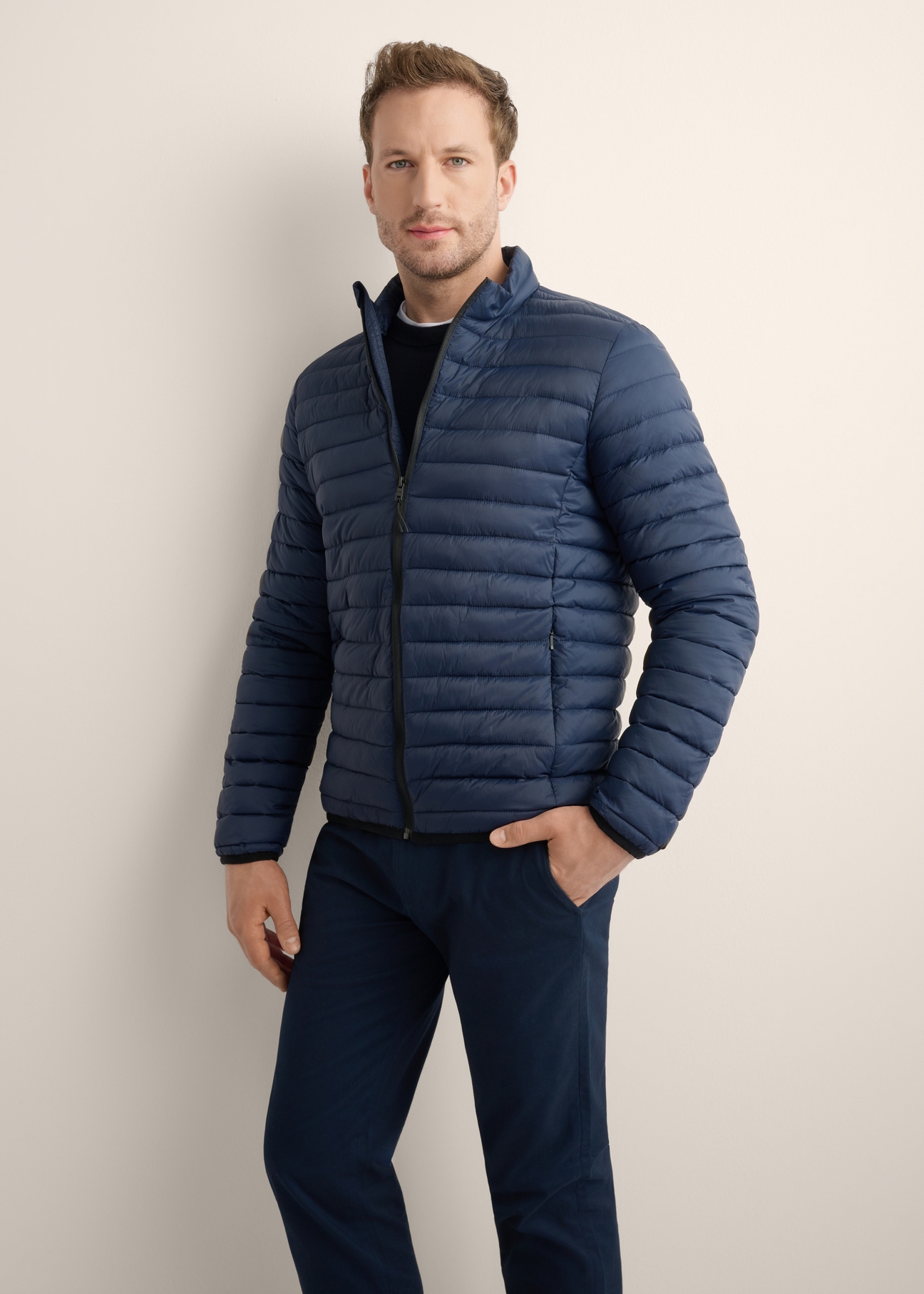 Navy blue men's transitional jacket KURMT-0382-7E(Z26), front view of the product on the model, half of the silhouette visible.