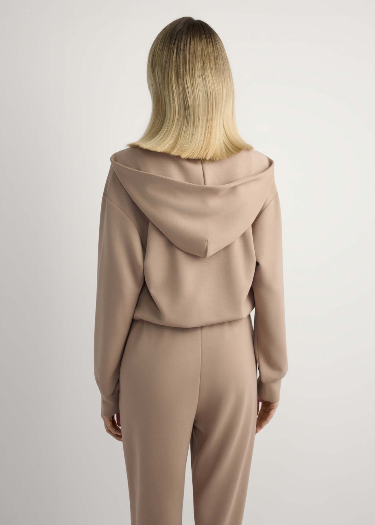 Camel women's zip-up sweatshirt BLZDT-0108A-1D(W26), back view of the product on the model. Half of the silhouette visible.