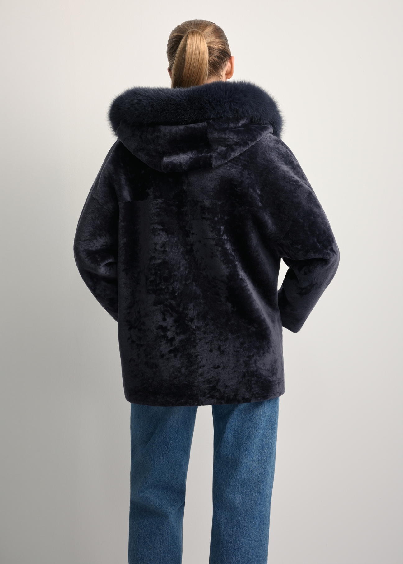 Women's double-sided leather sheepskin coat KOZDS-0094-1397(Z25), back view of the product on the model. Half of the silhouette visible.