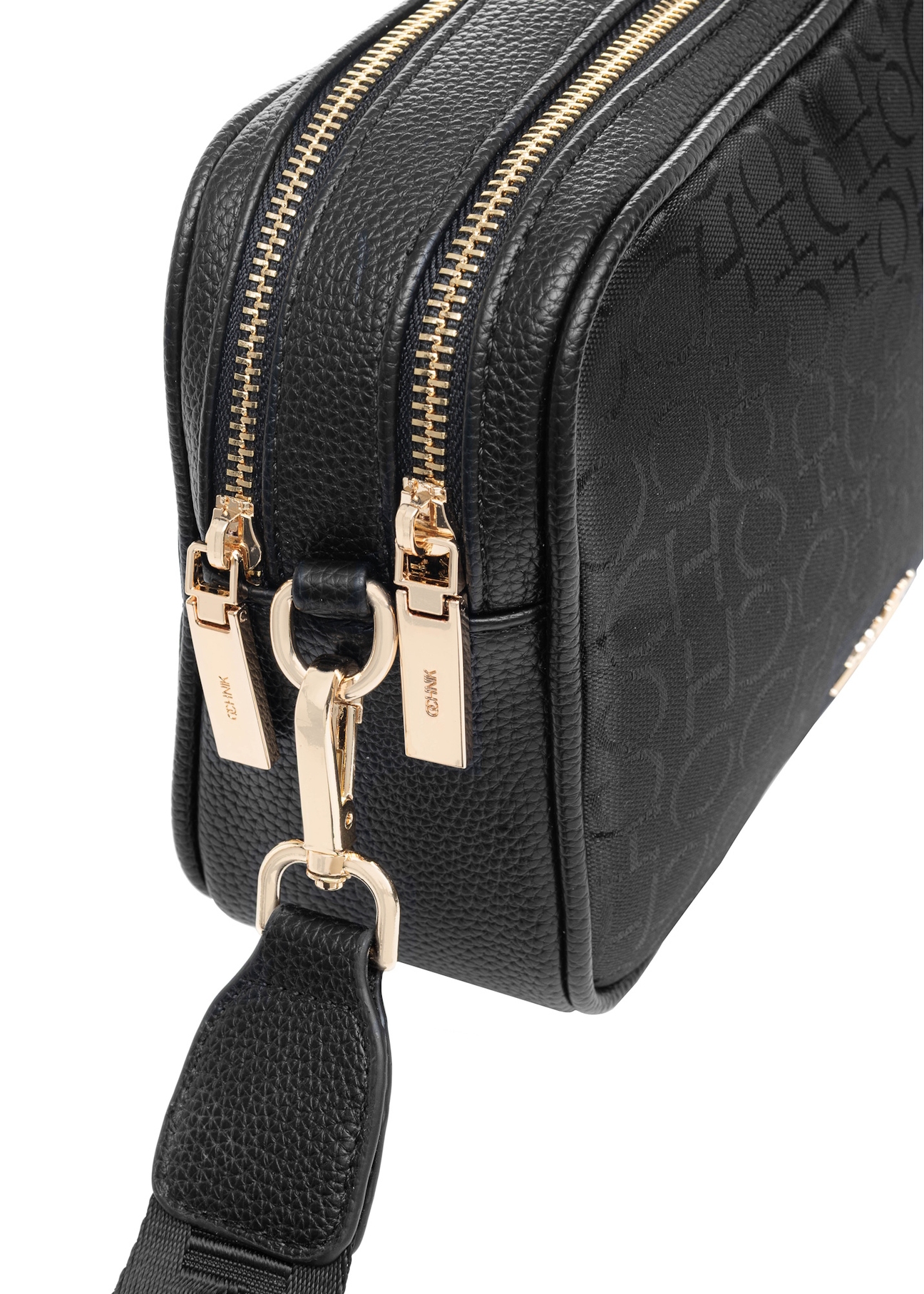 Black women's handbag with monogram TOREN-0277A-99(W25), close-up of detail on white background.