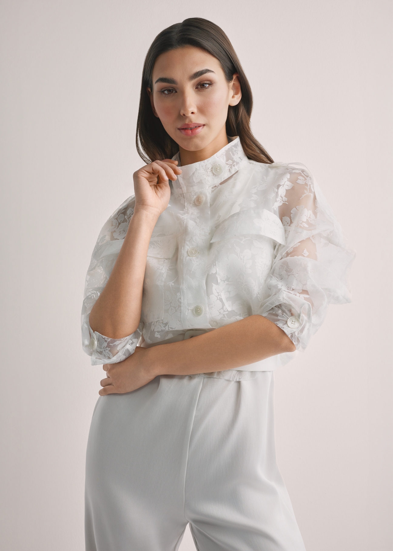 Women's white lace shirt KURDT-0637-0A(W26), front view of the product on the model. Half of the silhouette visible.