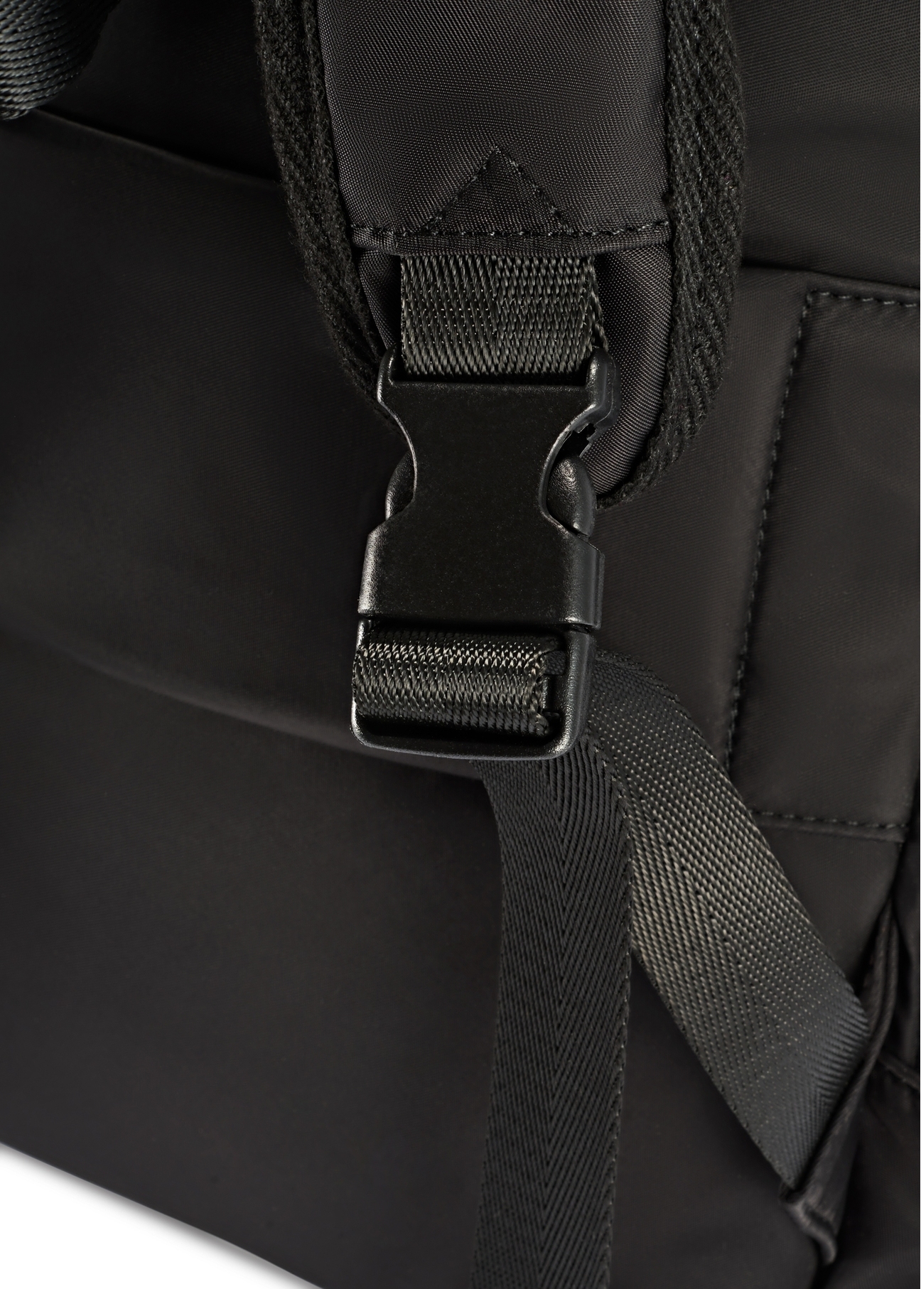 Black large women's backpack TOREN-0321-99(Z25), close-up of the product buckle, view on a white background.