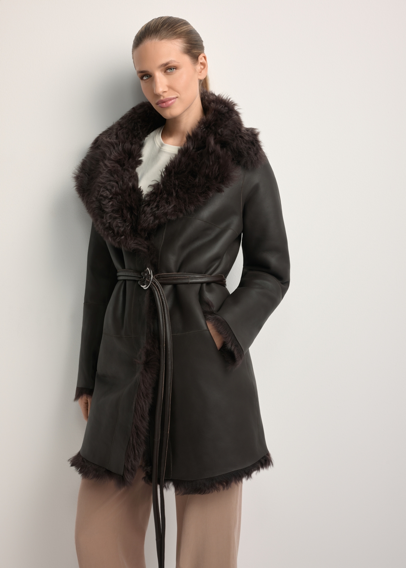 Women's brown double-sided leather sheepskin coat KOZDS-0090-1393(Z25), front view of the product on the model. Half of the silhouette visible.