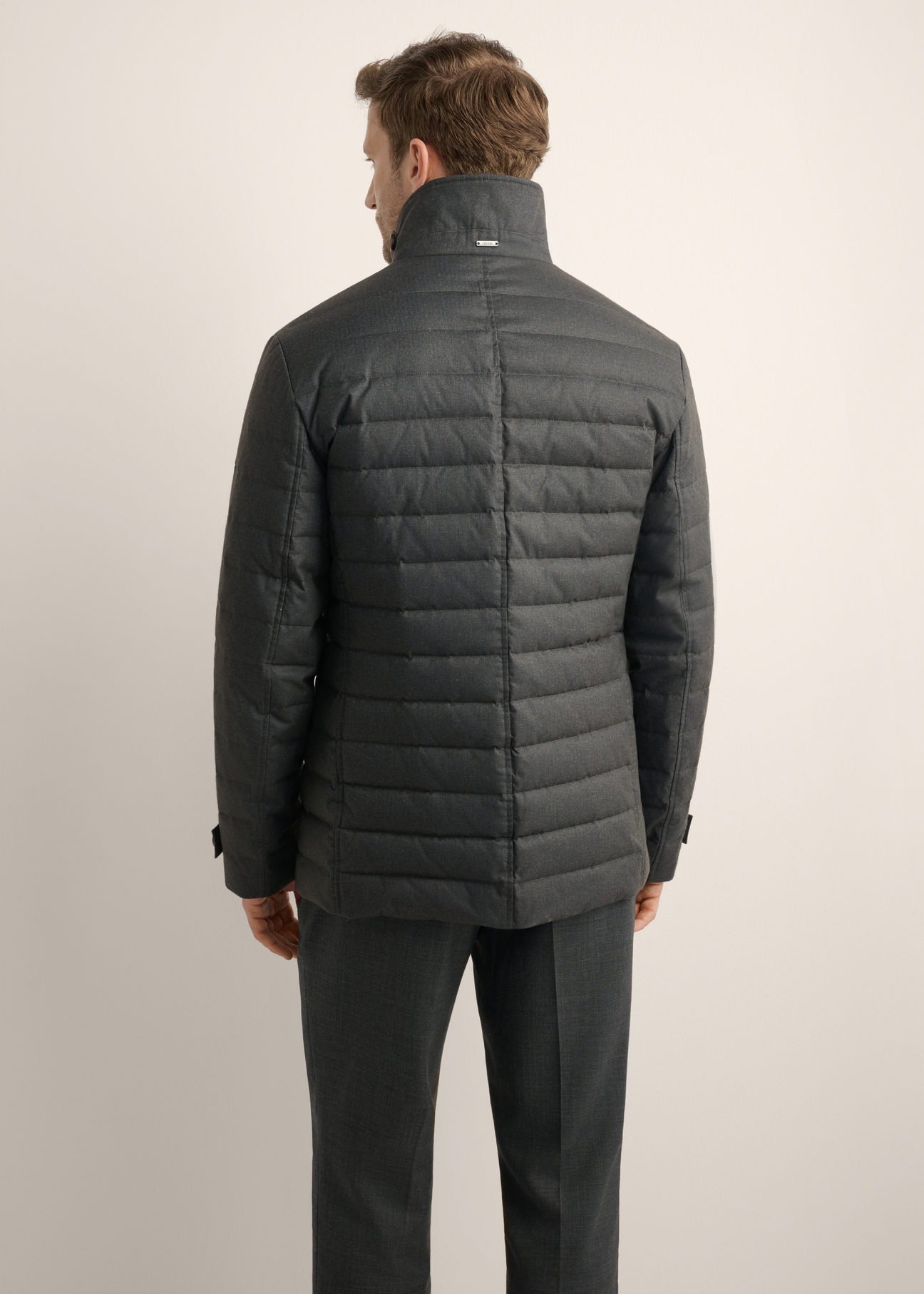 Gray men's jacket with natural insulation KURMT-0424-9C(Z26), product view from the back on the model. Half of the silhouette visible.