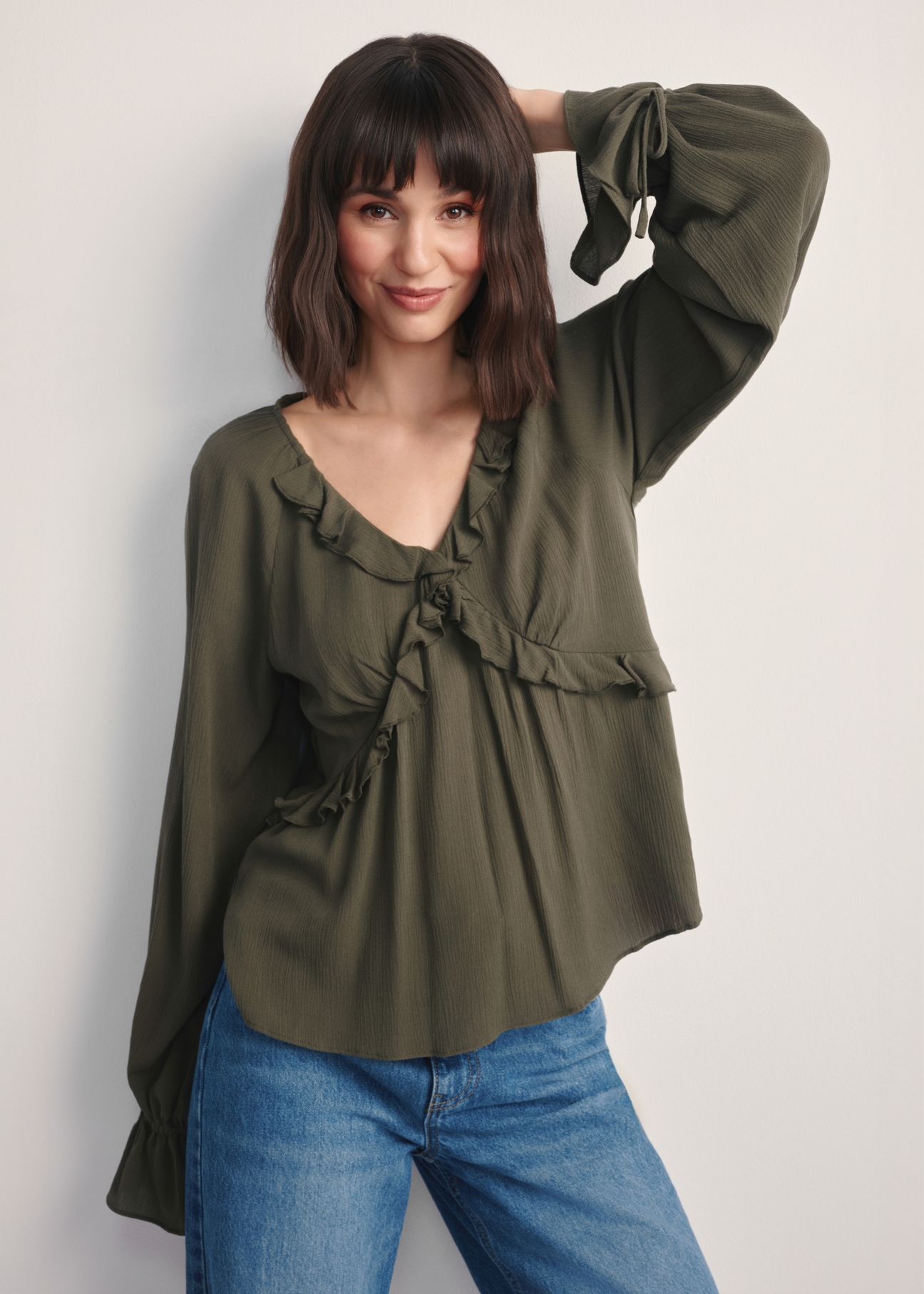 Women's khaki blouse BLUDT-0194-55(Z25), front view of the product on the model, half of the silhouette visible.-02