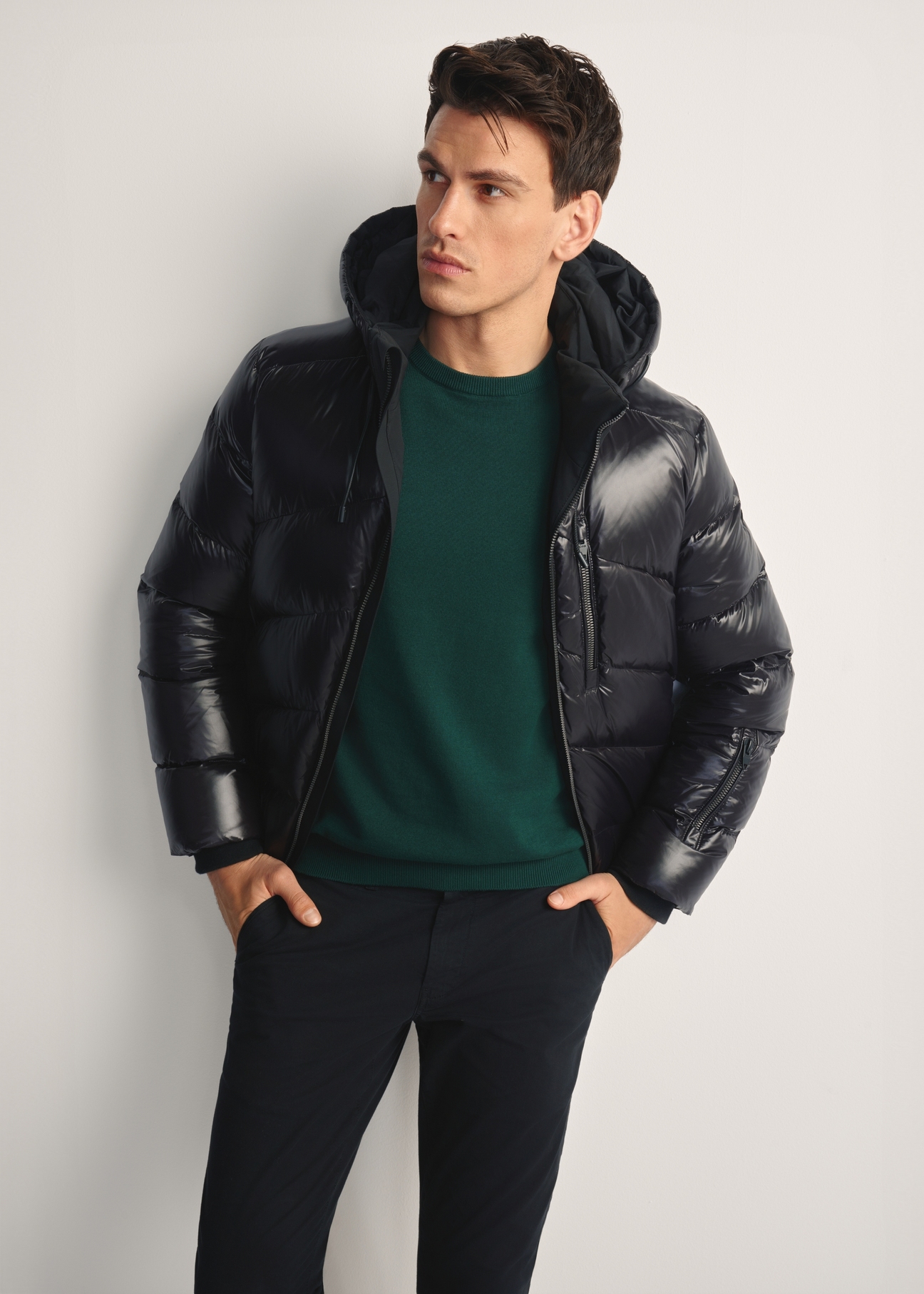 Men's black jacket with natural insulation KURMT-0393-99(Z25) - front view of the product on a model, against a white background. Knee-length silhouette visible.