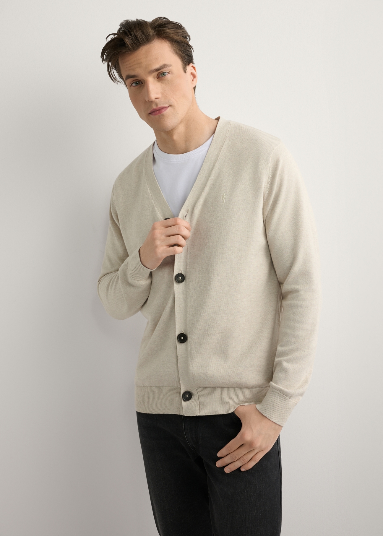 Men's light beige cotton cardigan KARMT-0003-1A(W26), front product view on model. Half silhouette visible.