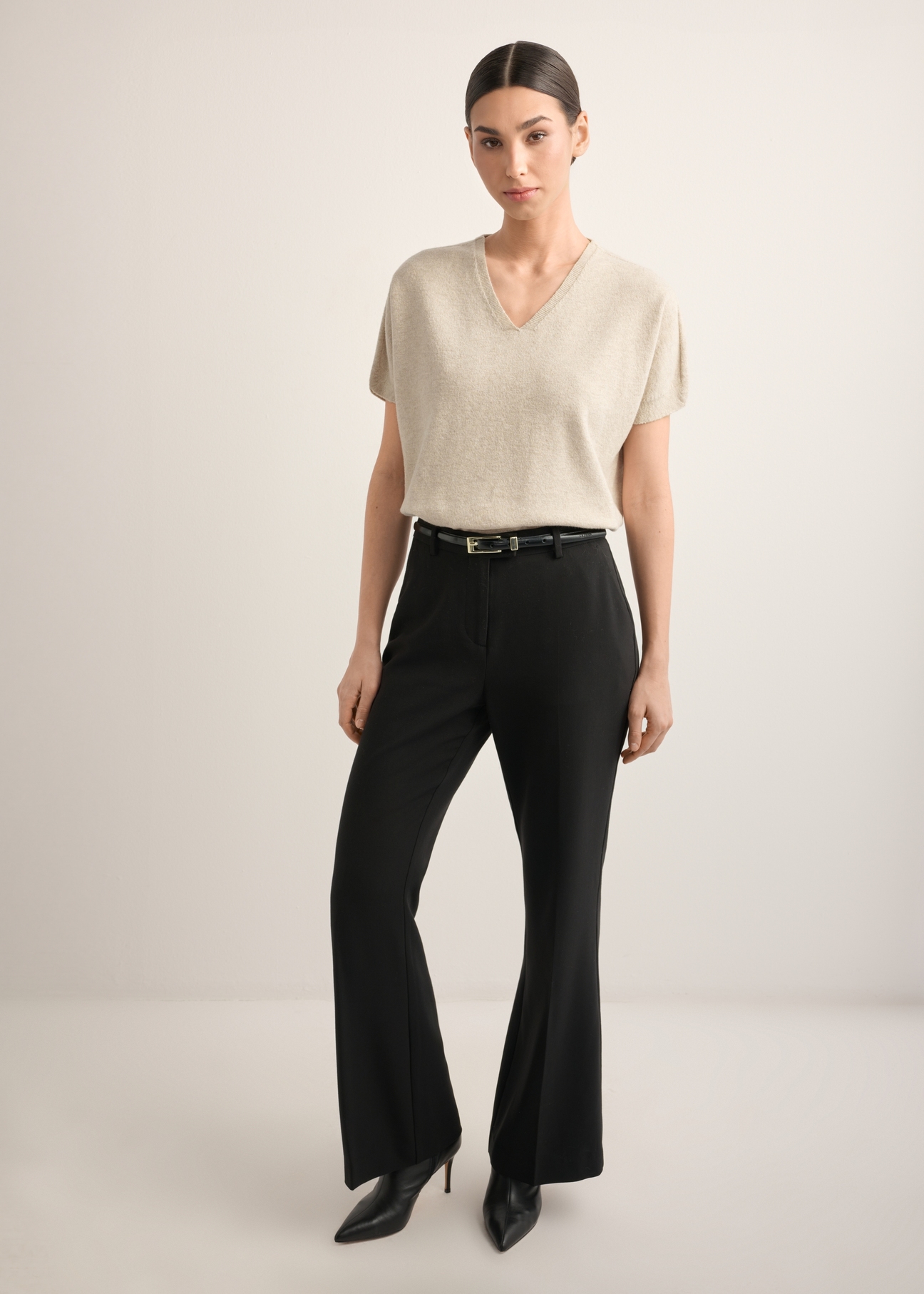 Beige women's knit blouse BLUDT-0214-1A(Z26), front view of the product on the model. Full body visible.