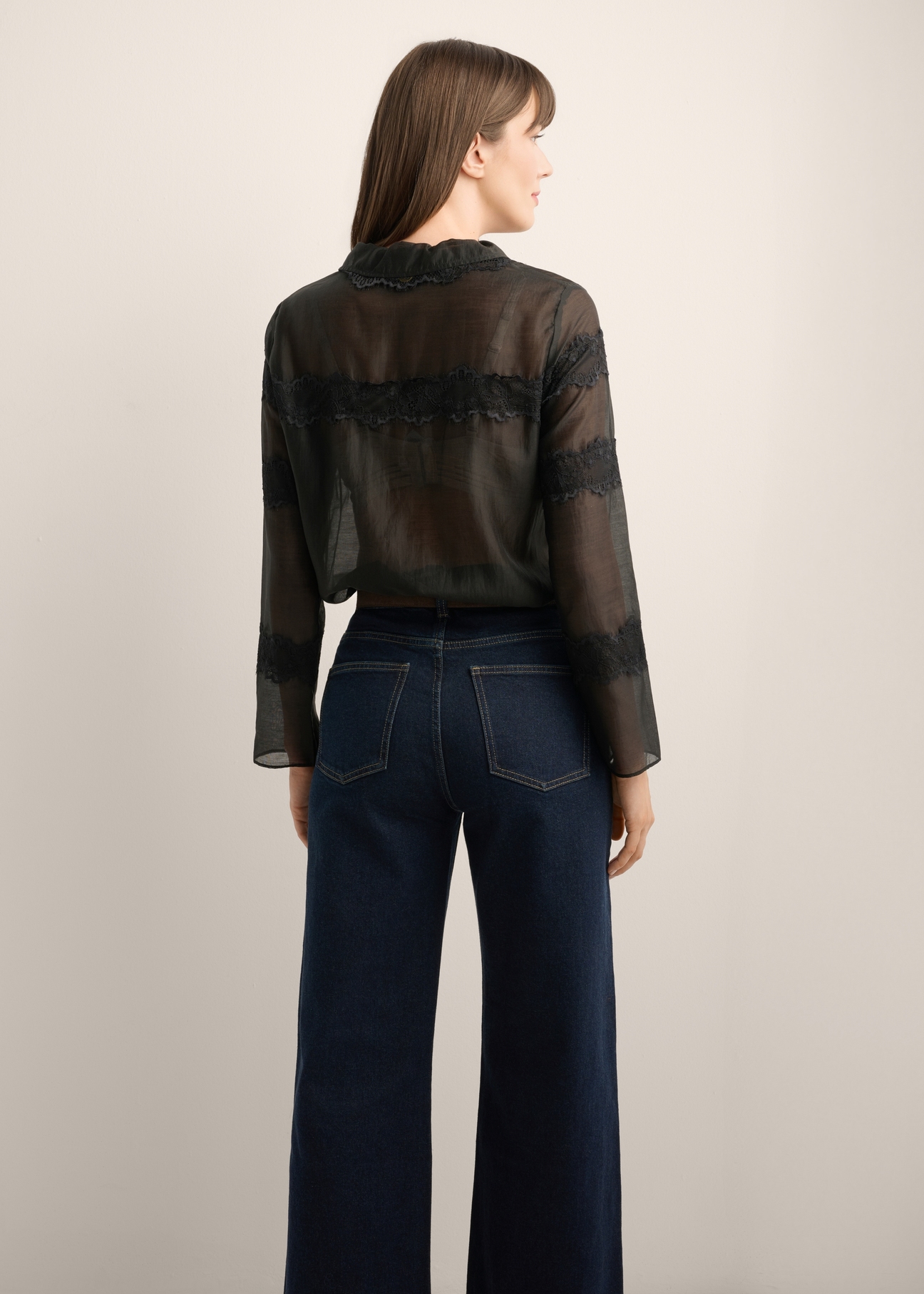 Women's black lyocell shirt KOSDT-0194-99(Z26), back view of the product on the model. Half of the silhouette visible.